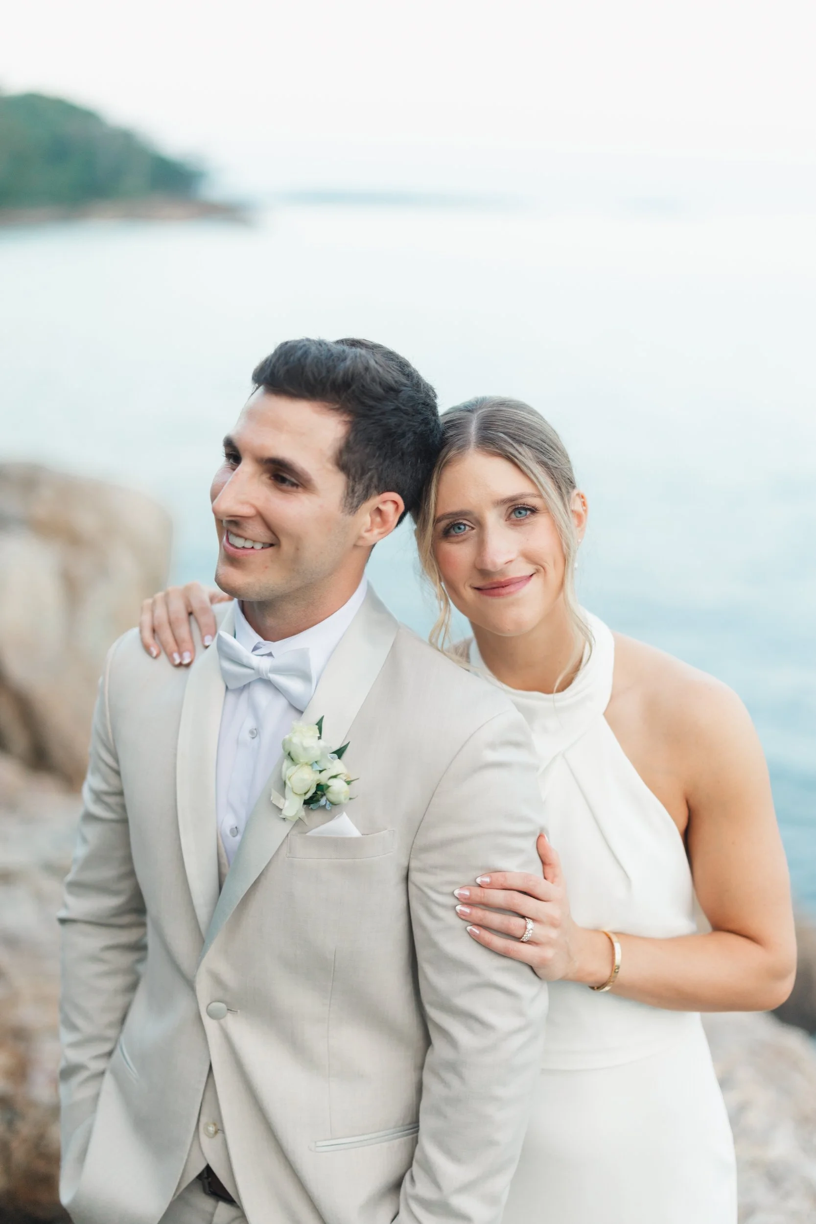 Romantic waterfront portraits captured in warm evening light.
