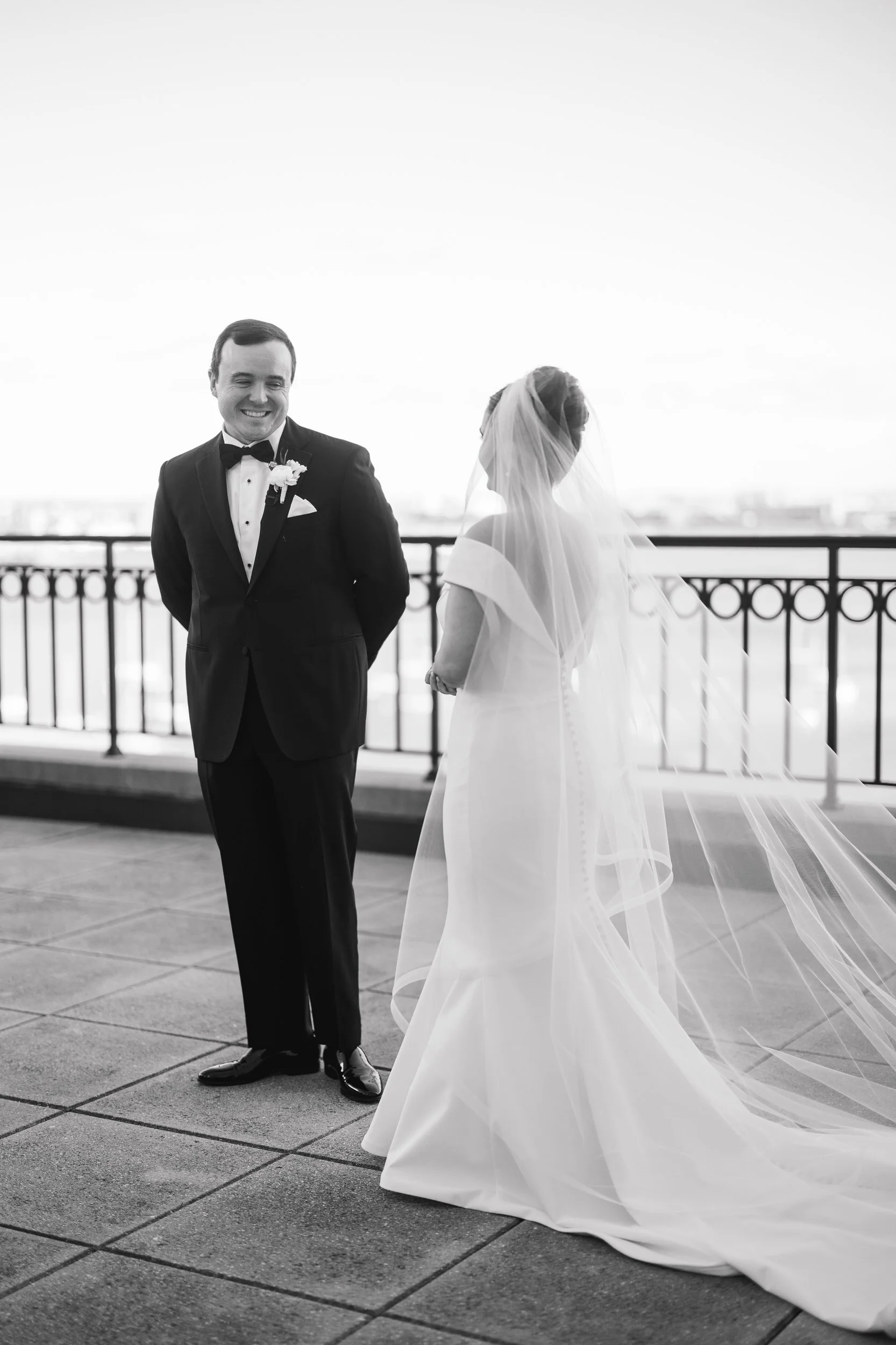 Candid rooftop first look moments at the Boston Harbor Hotel