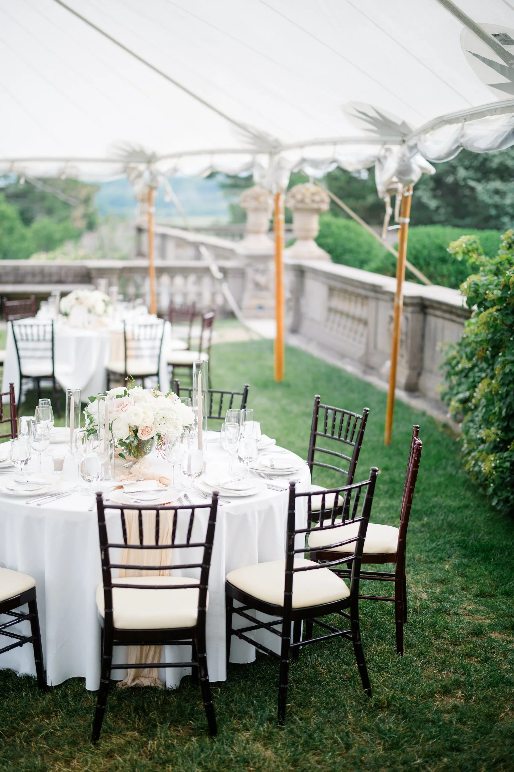Romantic tablescape featuring candlelight and florals for a Crane Estate wedding reception.
