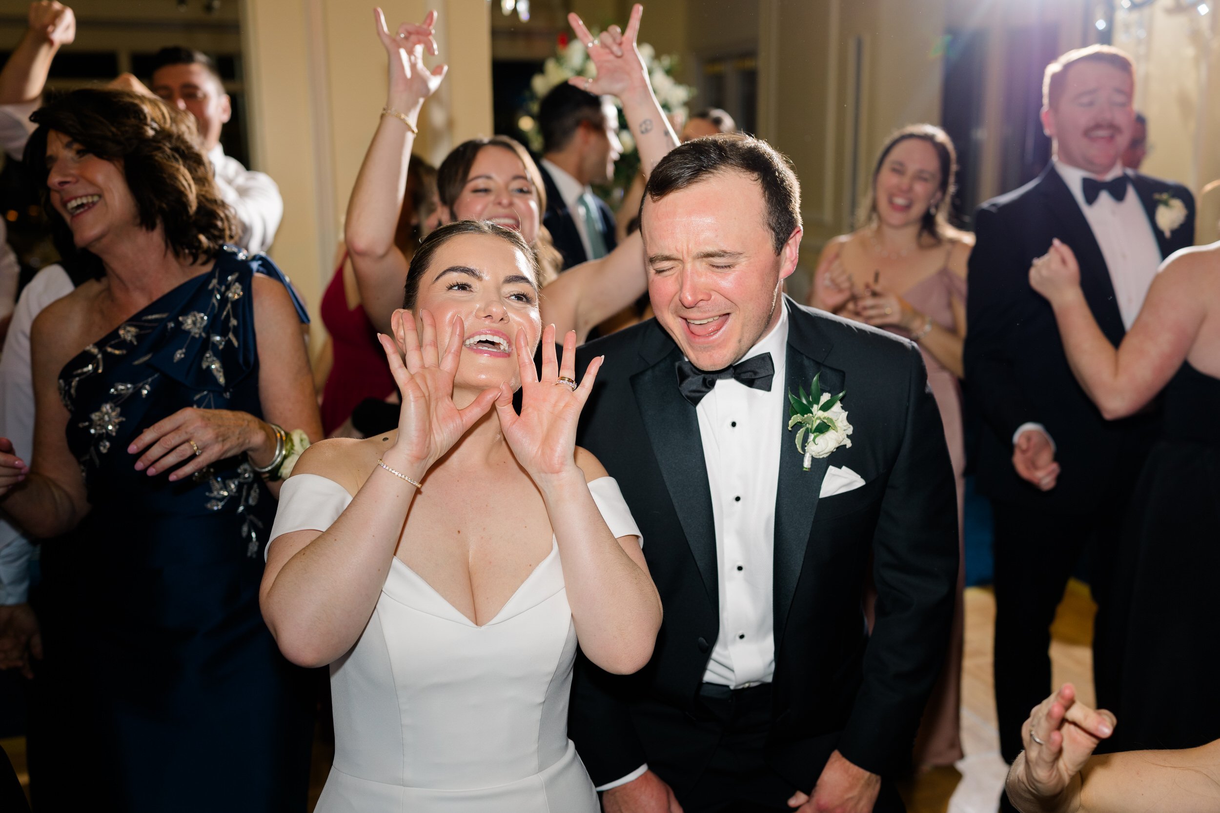 Joyful wedding celebration on the dance floor at the Boston Harbor Hotel