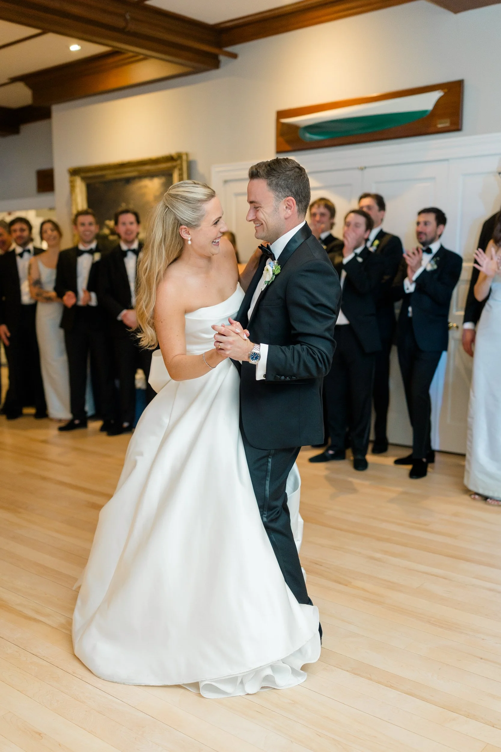 Wedding reception at Corinthian Yacht Club overlooking Marblehead Harbor with dancing and celebration.