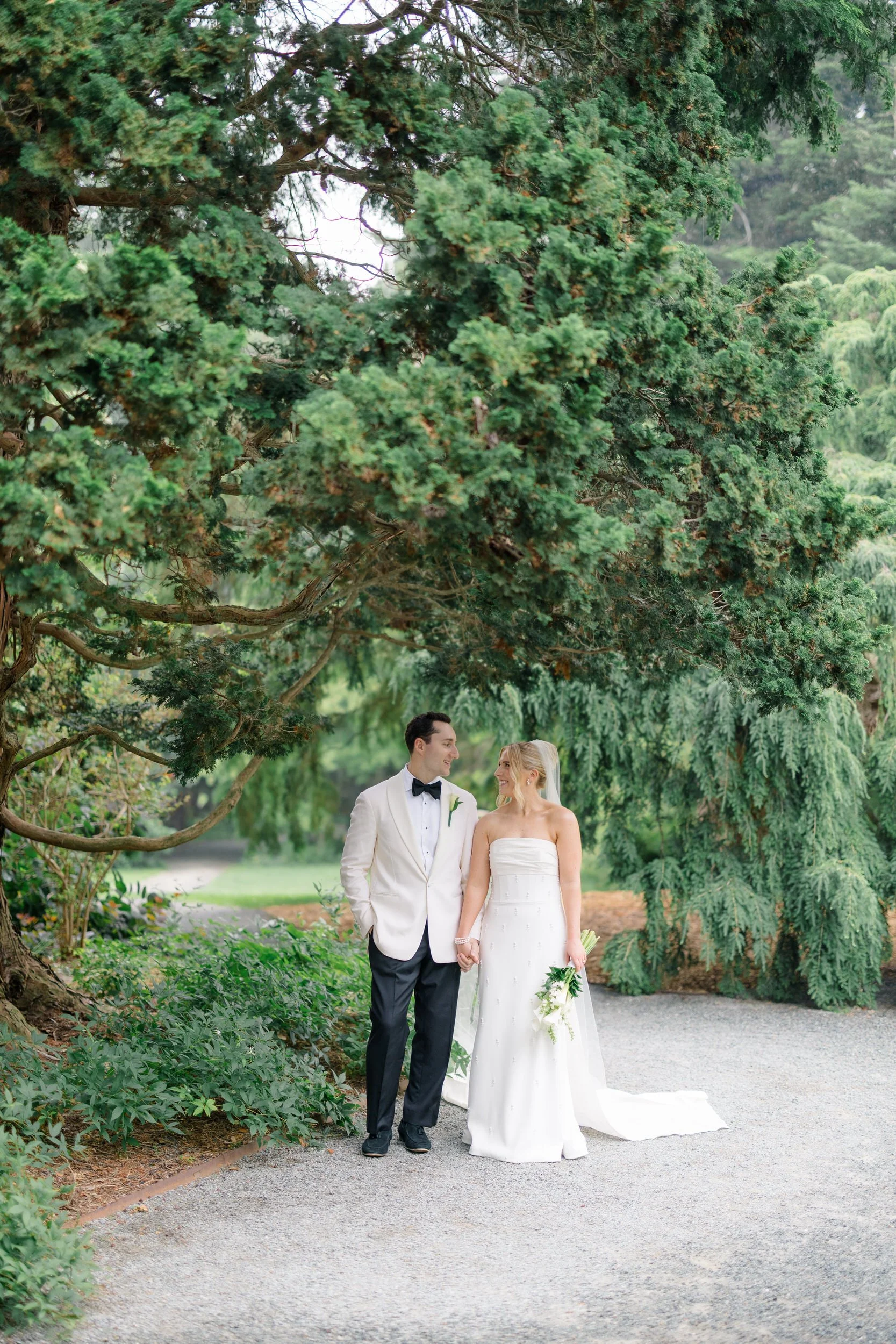 Bride and groom exploring the gardens during their Blithewold Wedding.
