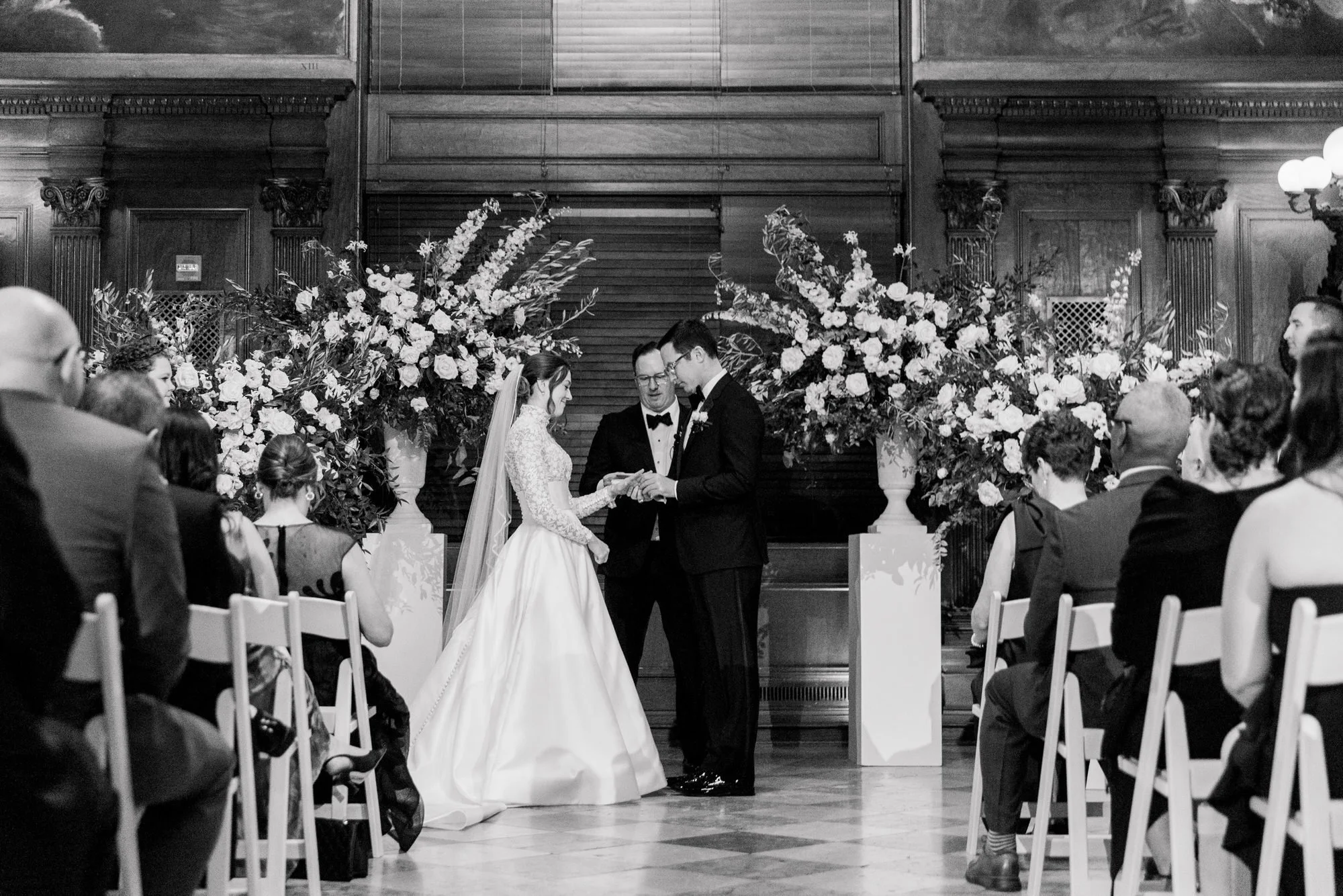 Bride and groom exchange rings at Boston Public Library Wedding