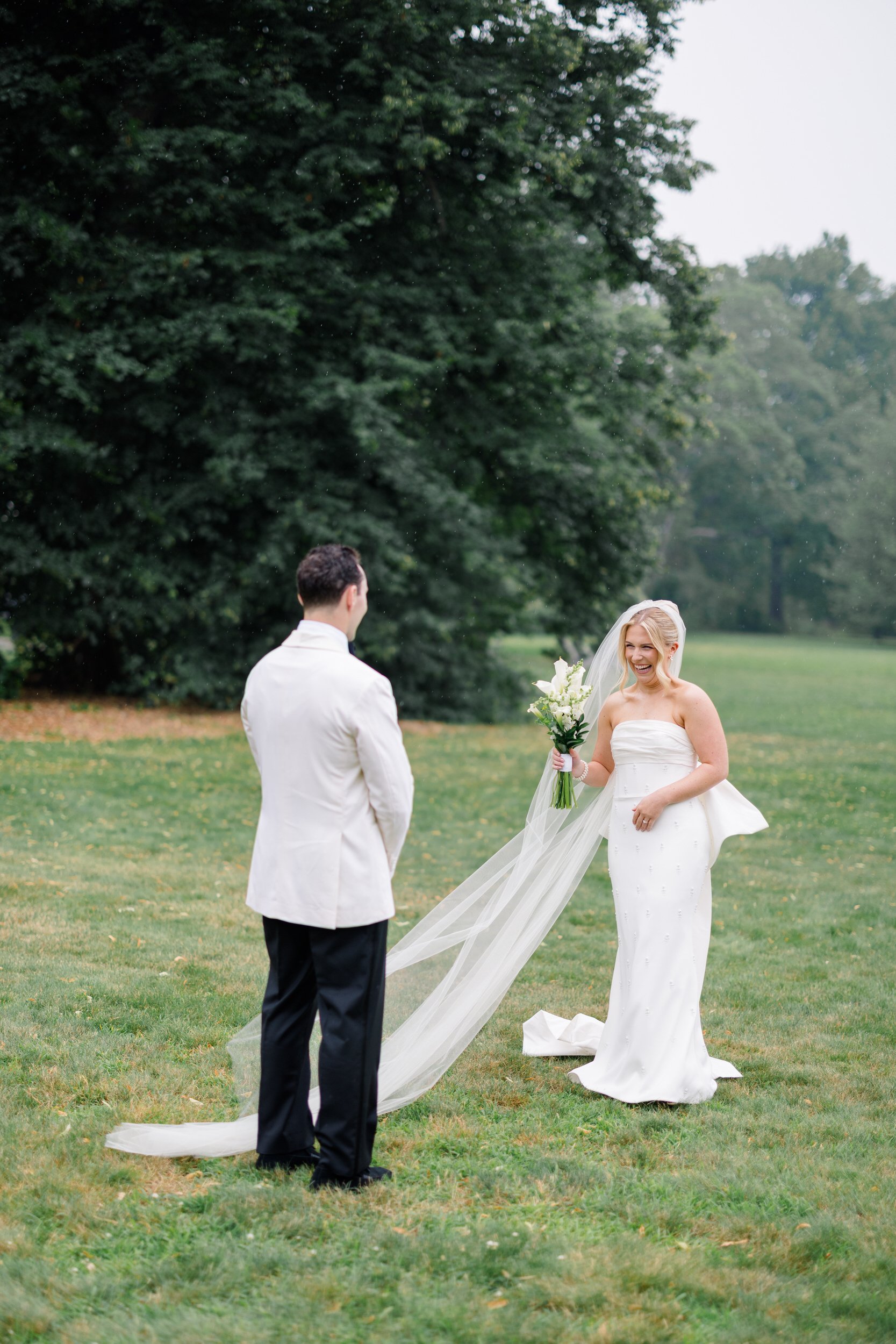 Bride and groom sharing an emotional first look in the gardens at Blithewold Mansion & Gardens.