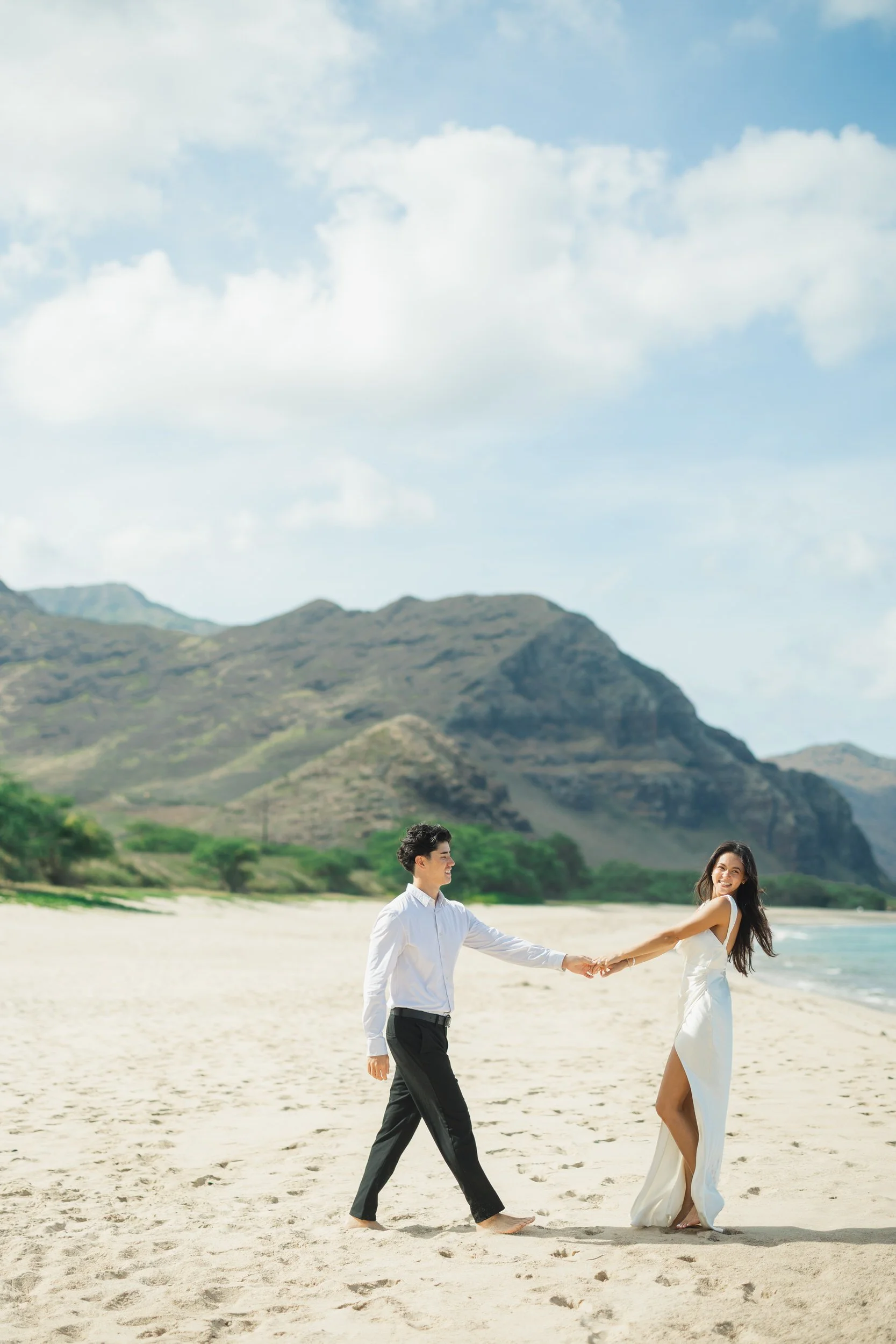 Candid couple moment during intimate Oahu beach elopement