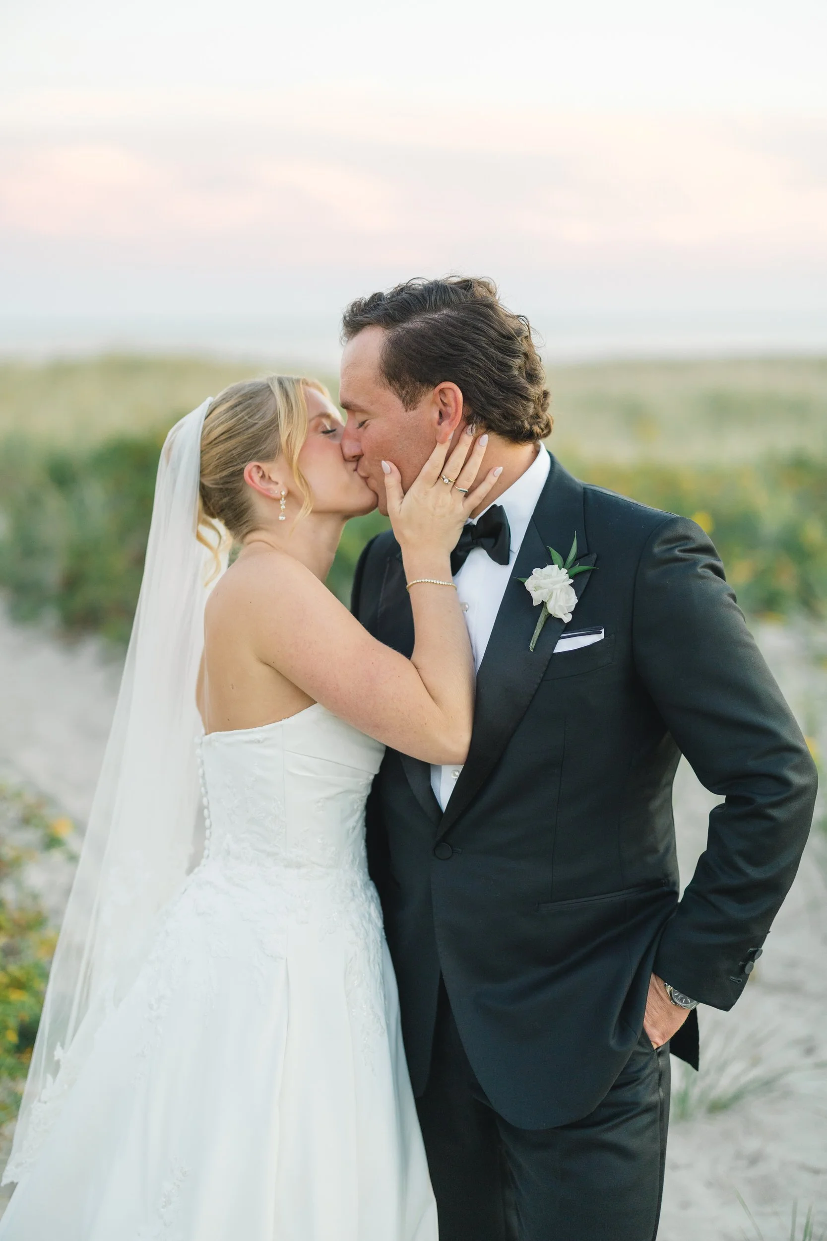Editorial sunset couple portraits at a waterfront wedding venue in Massachusetts.