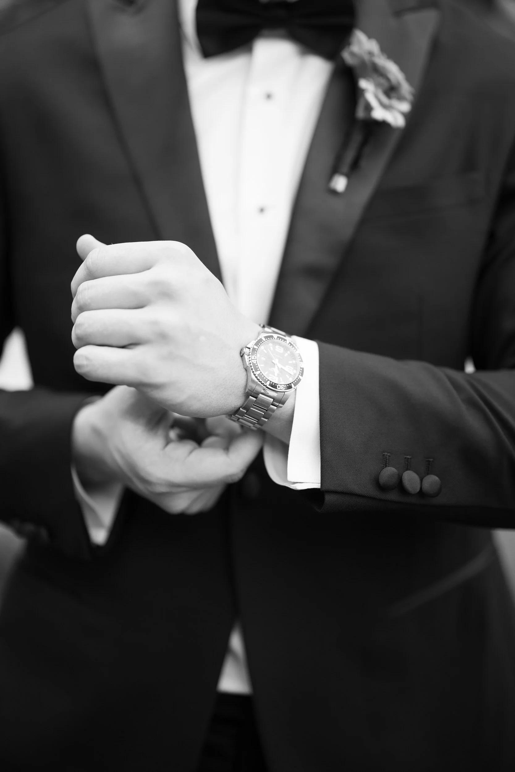 Groom preparing for his wedding day in a Hotel Commonwealth suite in Boston