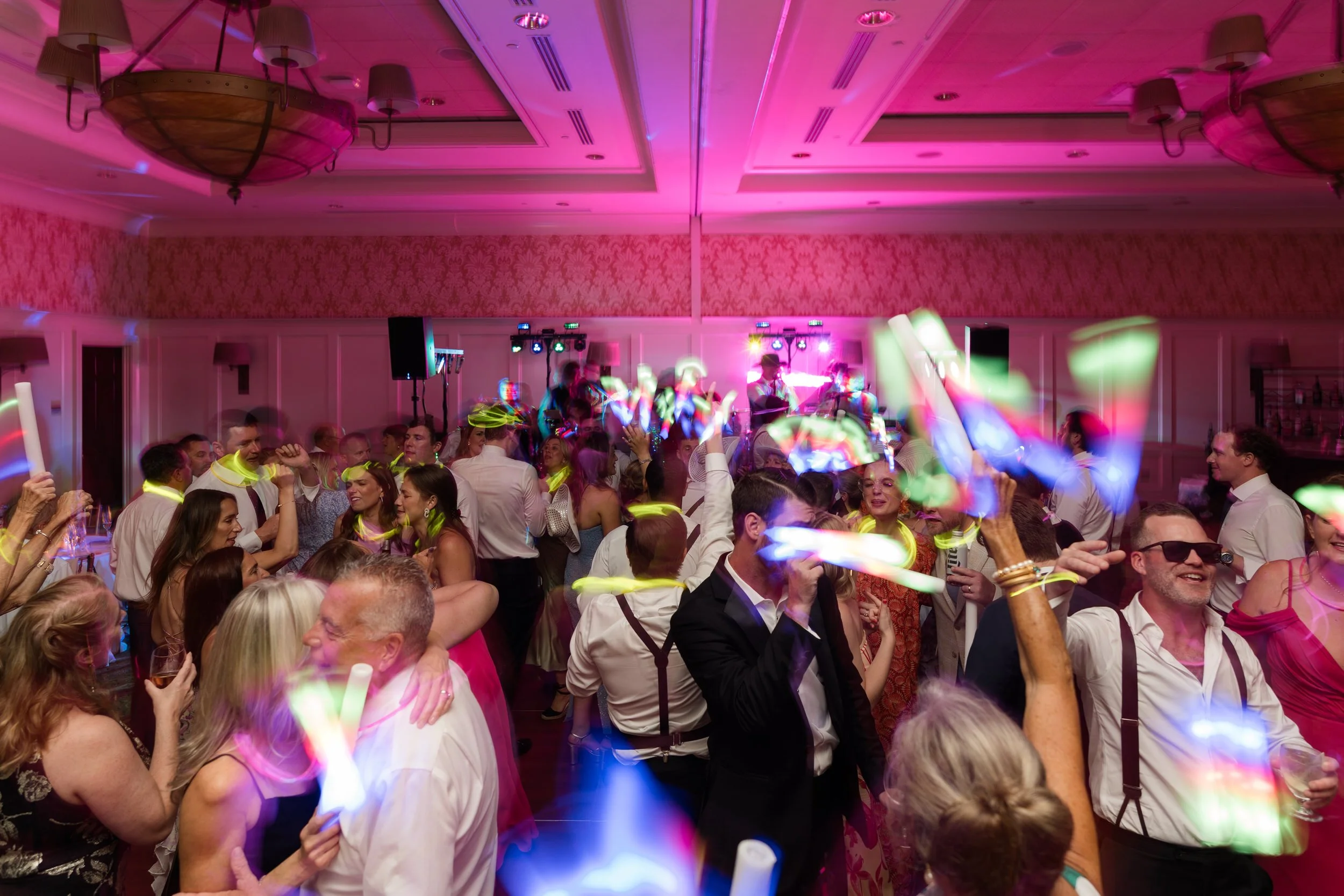 Wedding guests celebrating on the dance floor