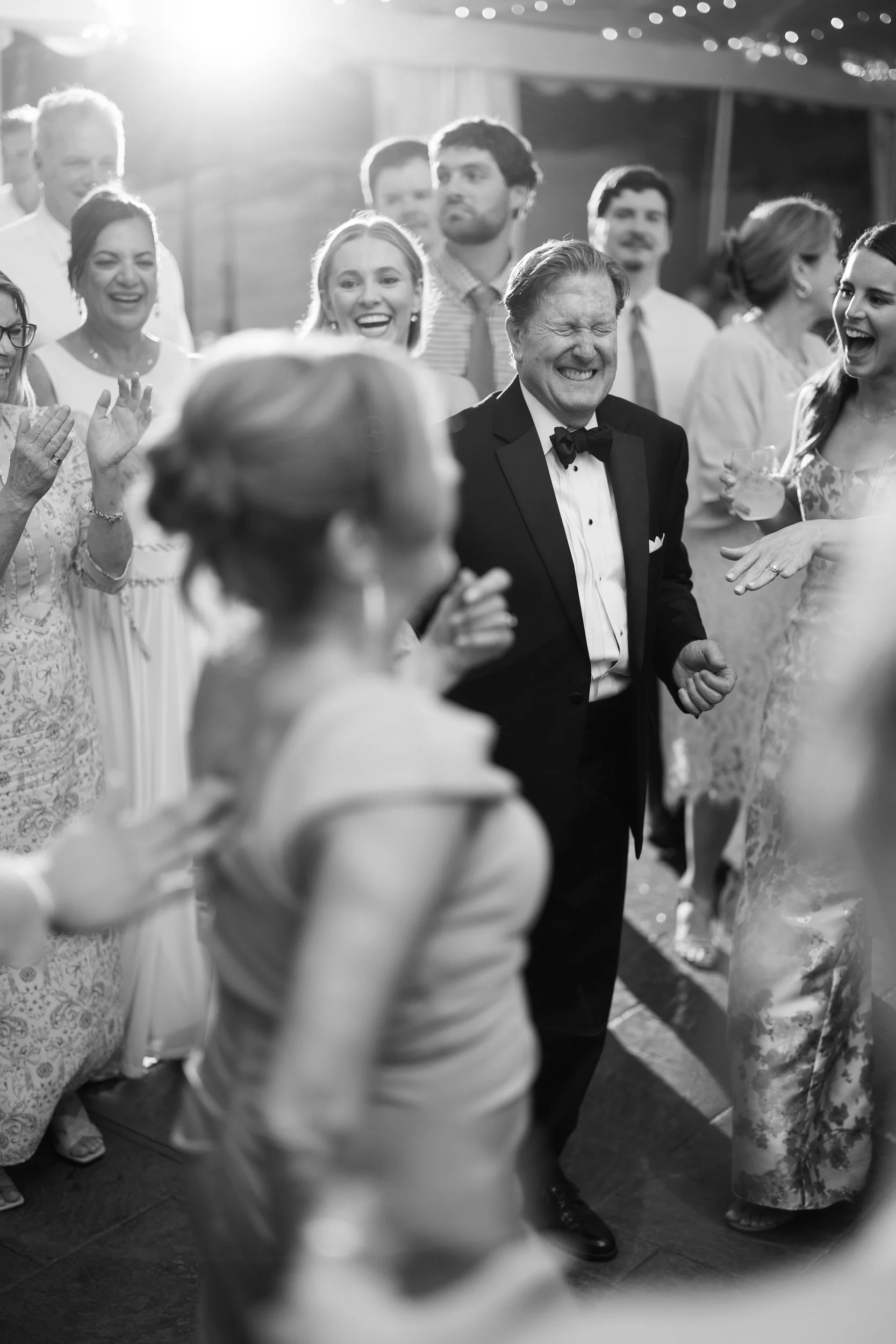 Joyful dance floor moments during a Blithewold Wedding.