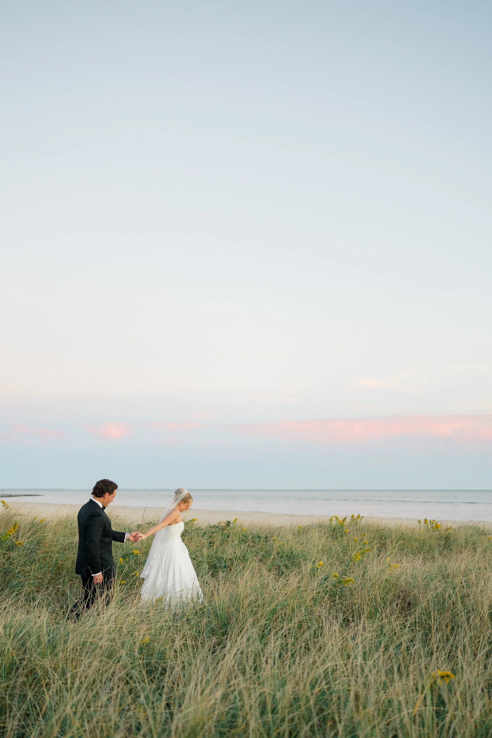 Golden hour wedding portraits overlooking the harbor at Wychmere Beach Club.