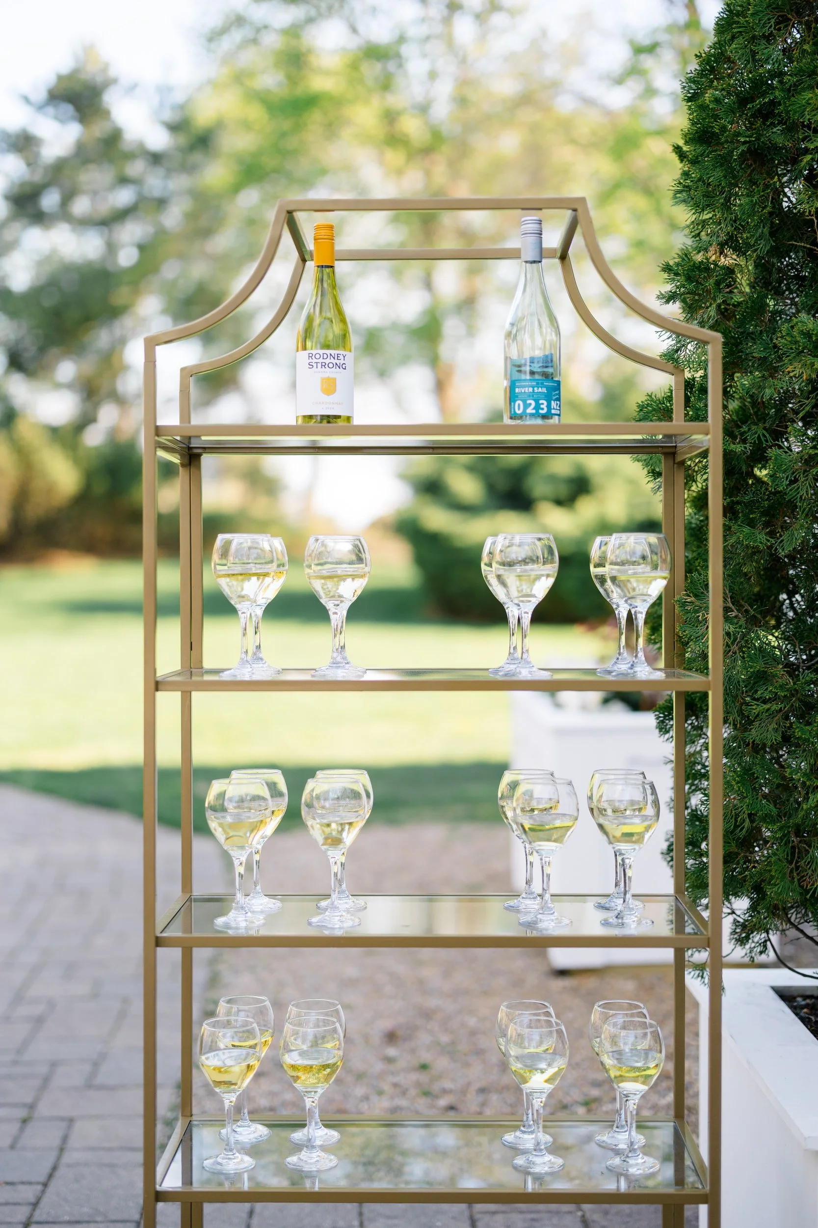 Sophisticated cocktail hour setup at oceanfront wedding venue