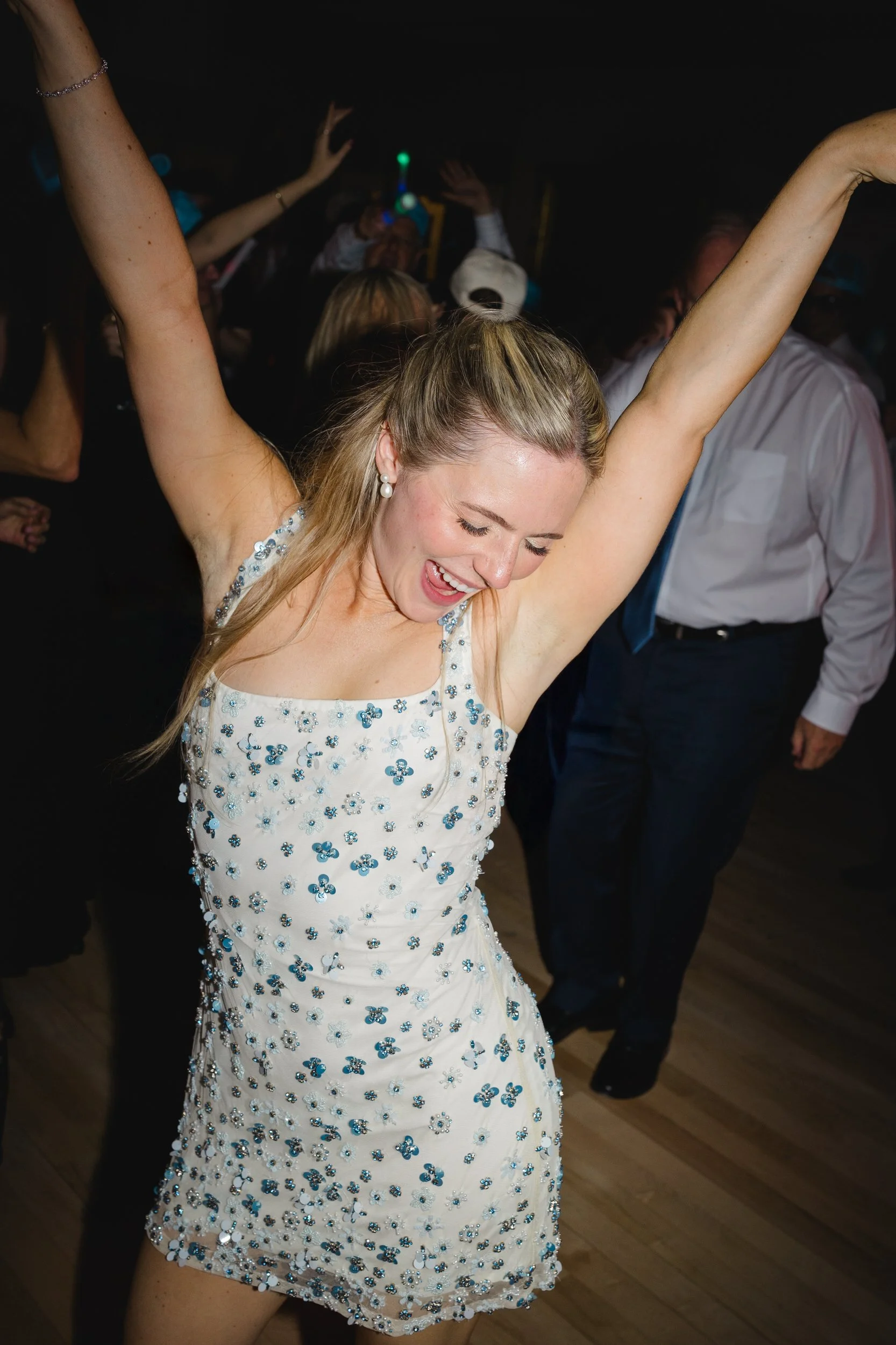 Packed dance floor during a Corinthian Yacht Club wedding celebration.