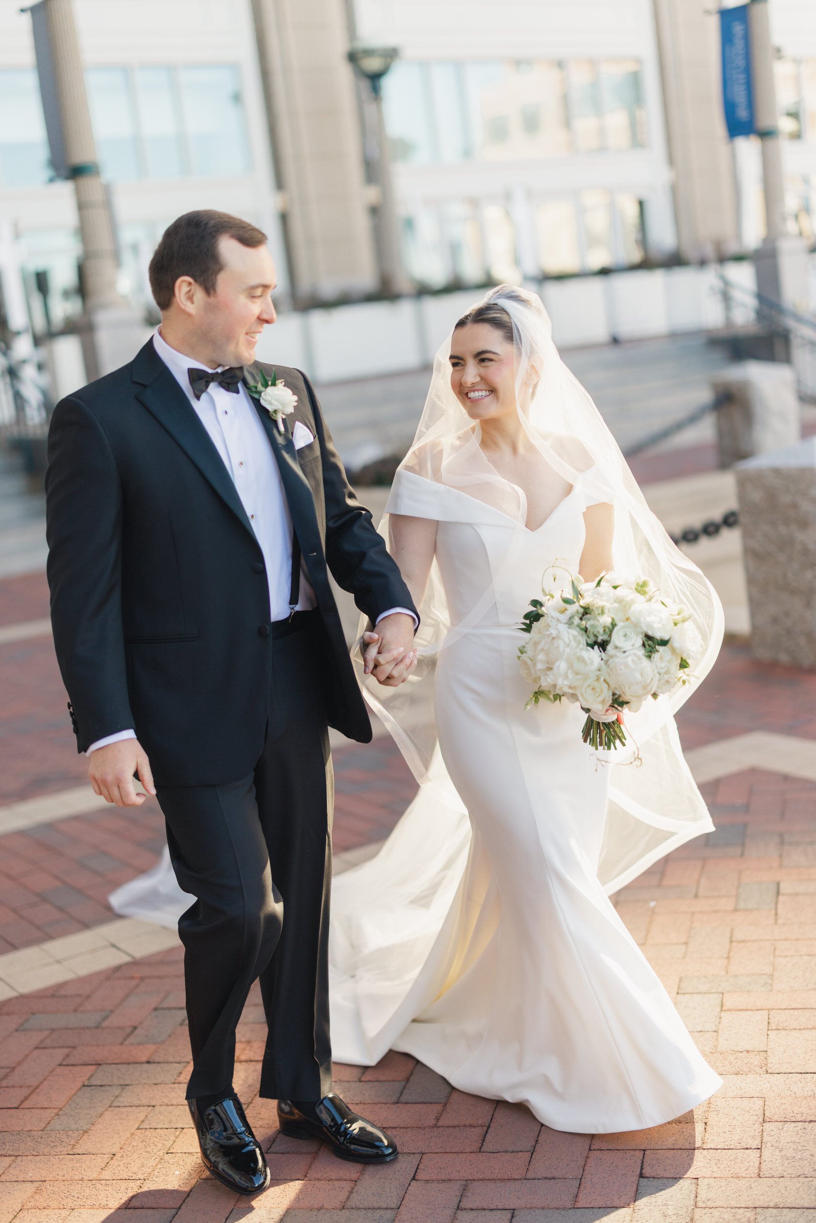 Romantic wedding portraits along the Boston Harbor Hotel waterfront