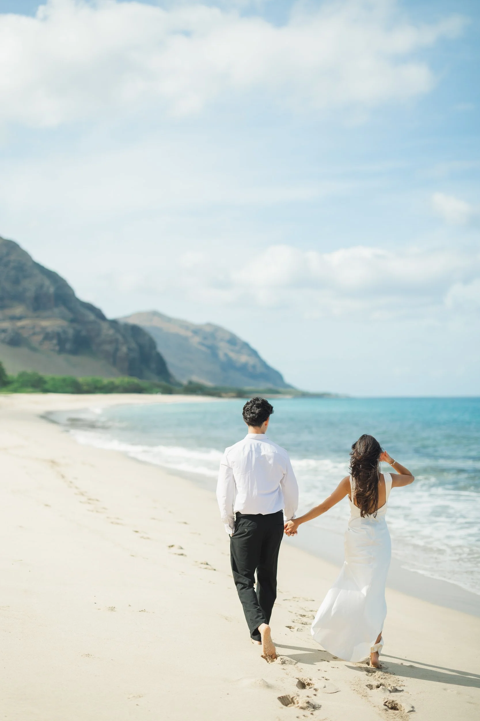 Candid couple moment during intimate Oahu beach elopement