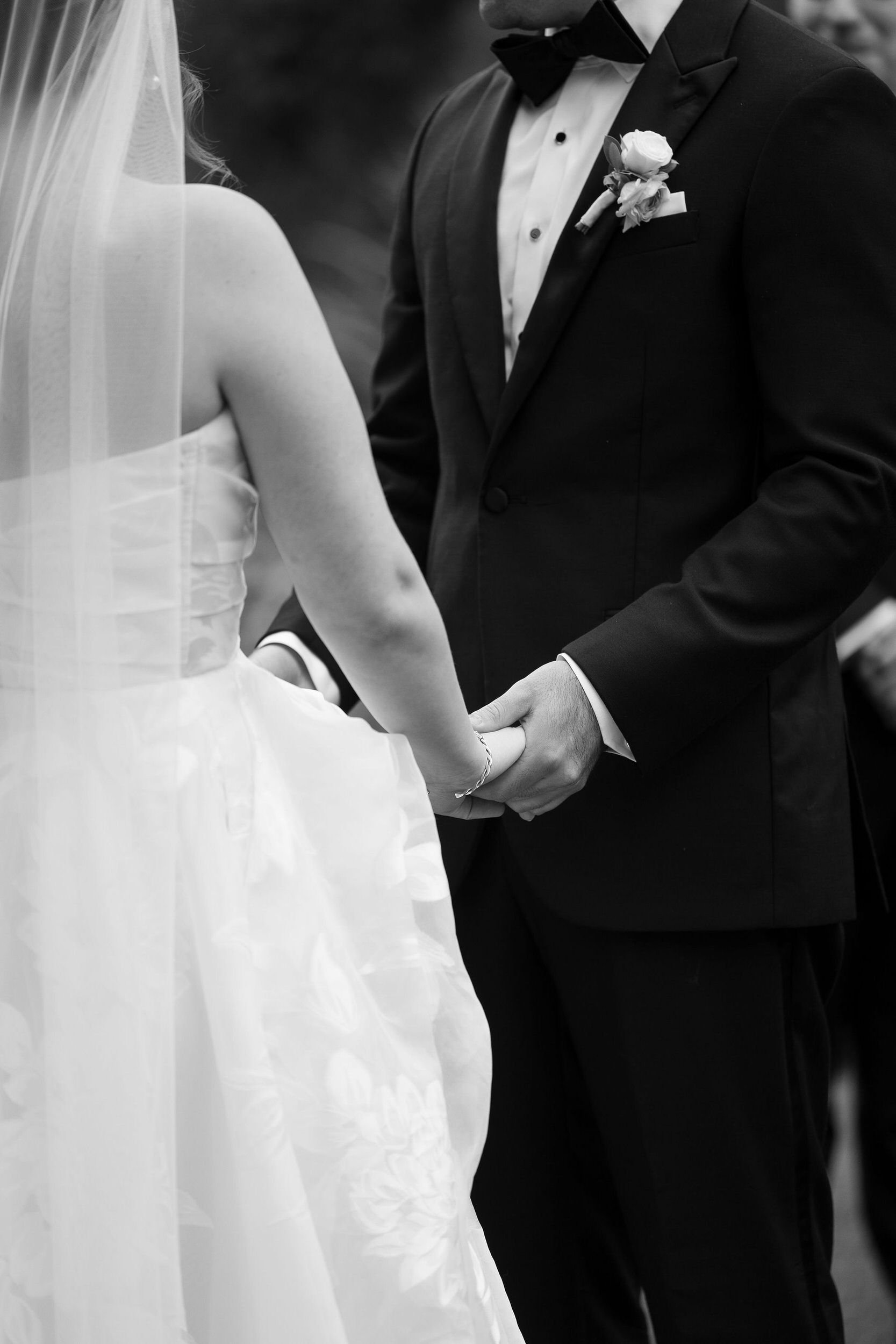 Wedding couple standing together during their outdoor ceremony at Long Hill.