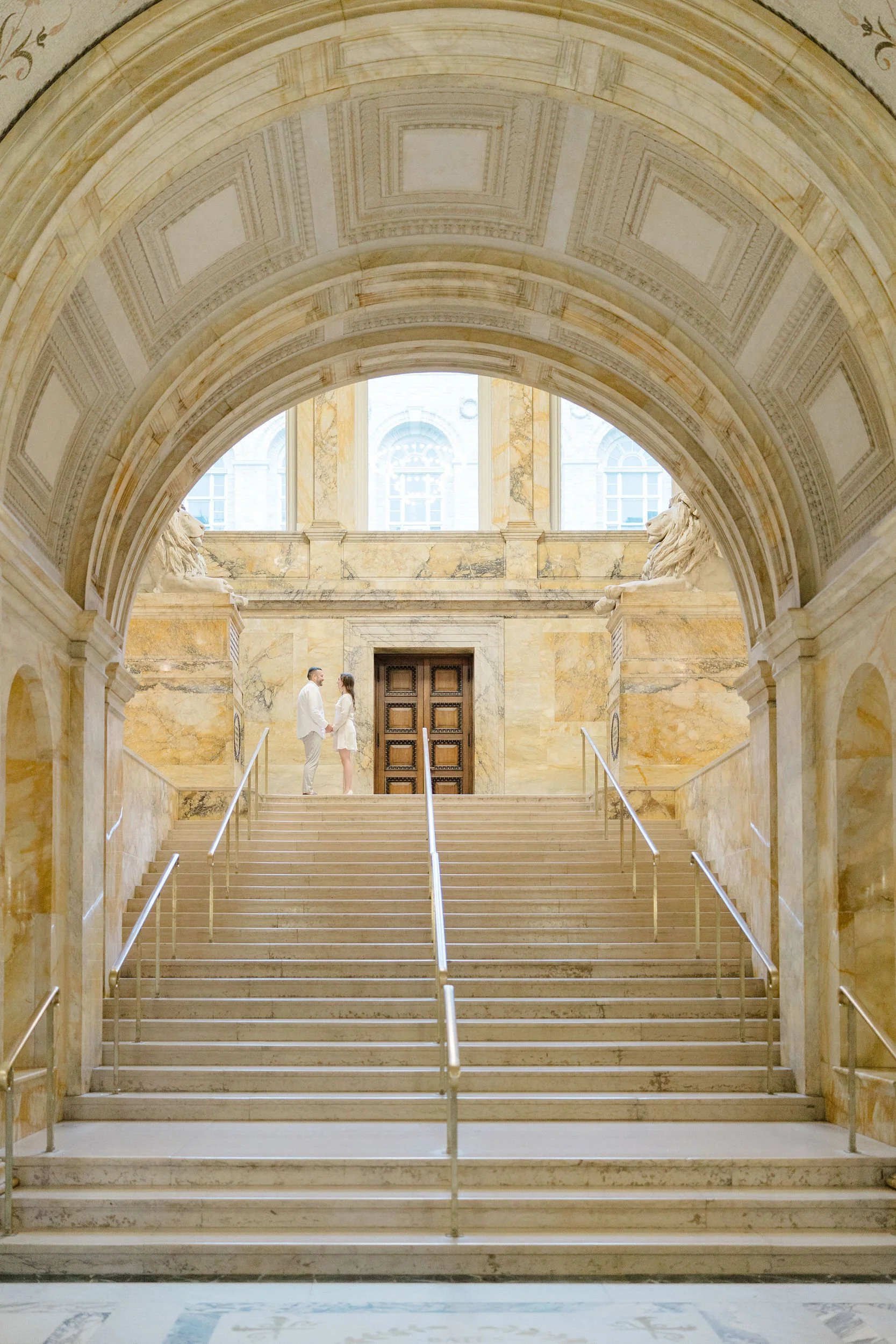 Couple posing during an engagement session at the Boston Public Library in Boston, Massachusetts