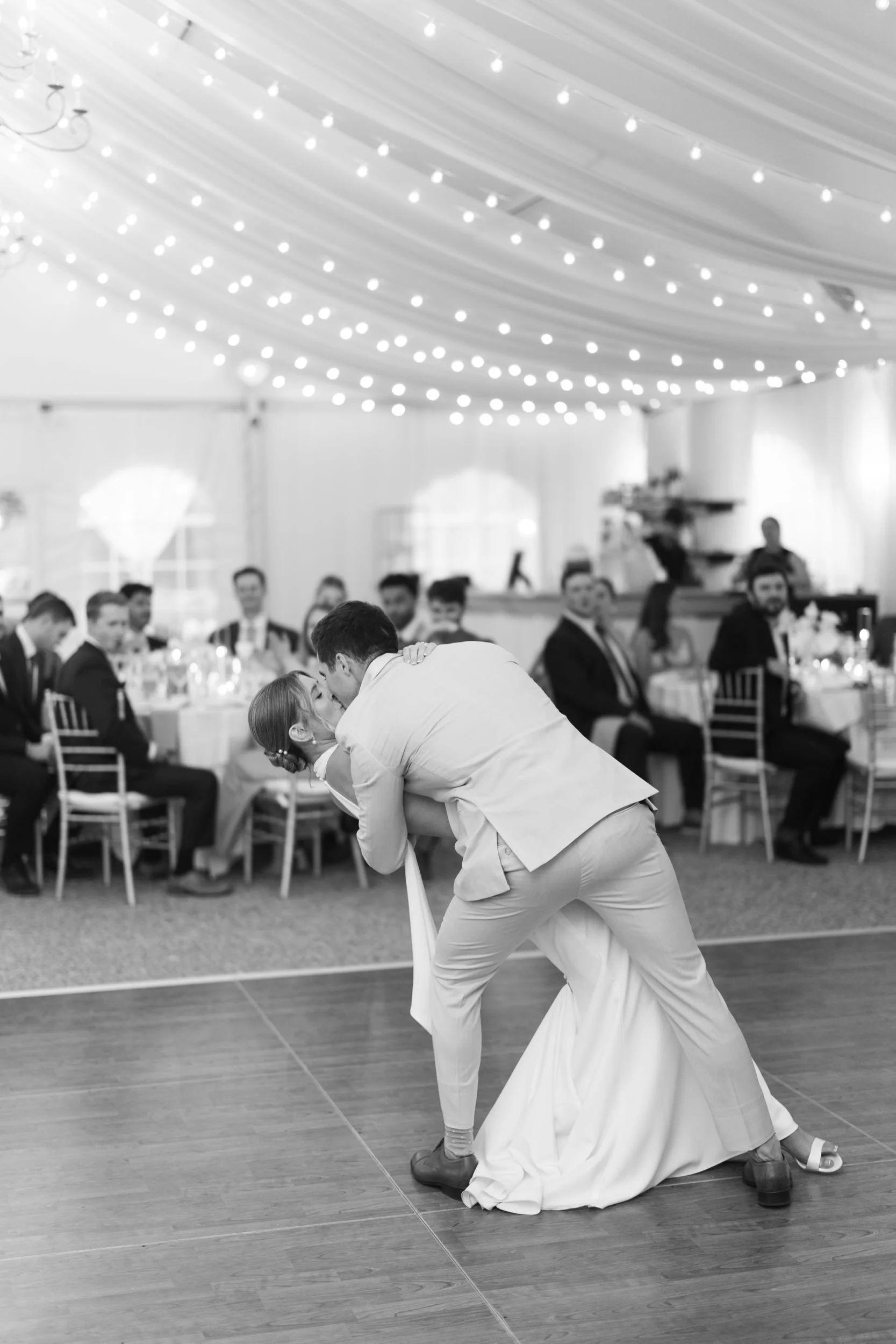 Newlyweds celebrating with family and friends during their reception.