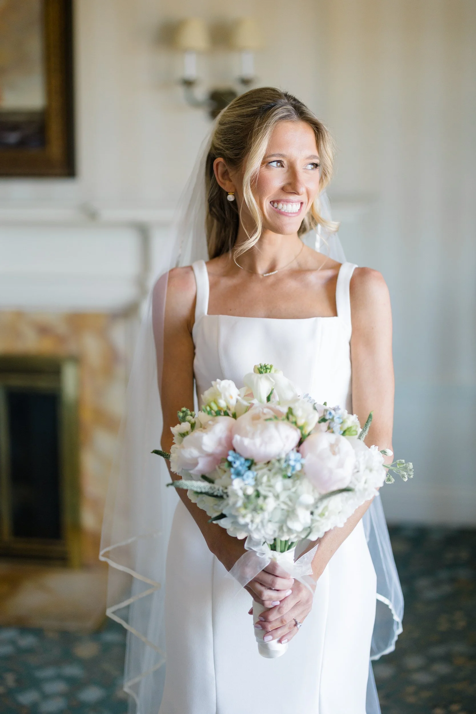 Bride putting on her wedding dress at Ocean Edge Resort