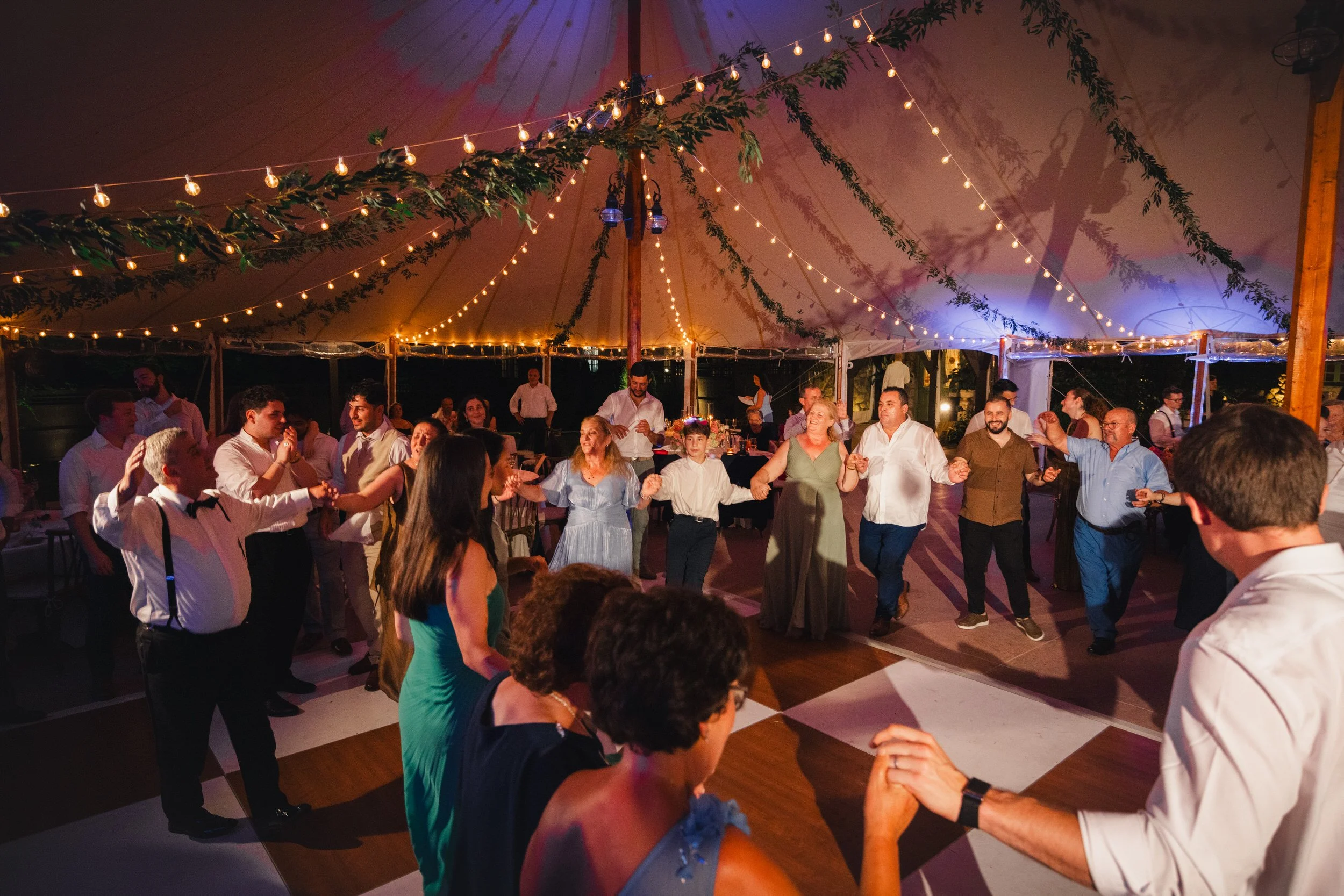 Wedding guests dancing at colorful Willowdale Estate reception in Massachusetts