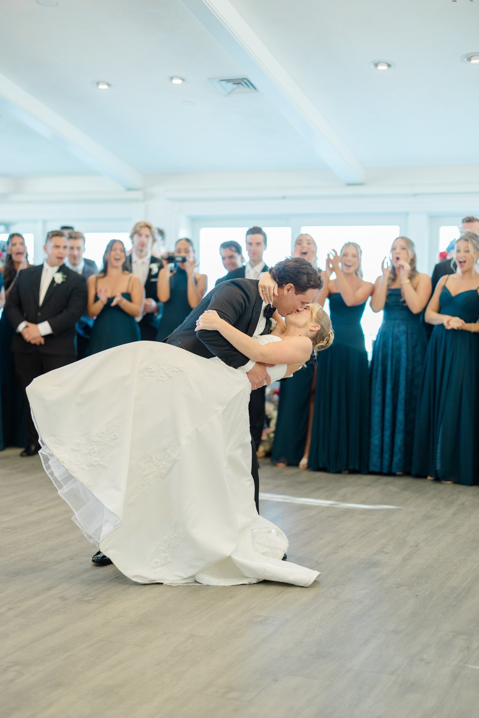 Newlyweds sharing their first dance at Wychmere Beach Club on Cape Cod.