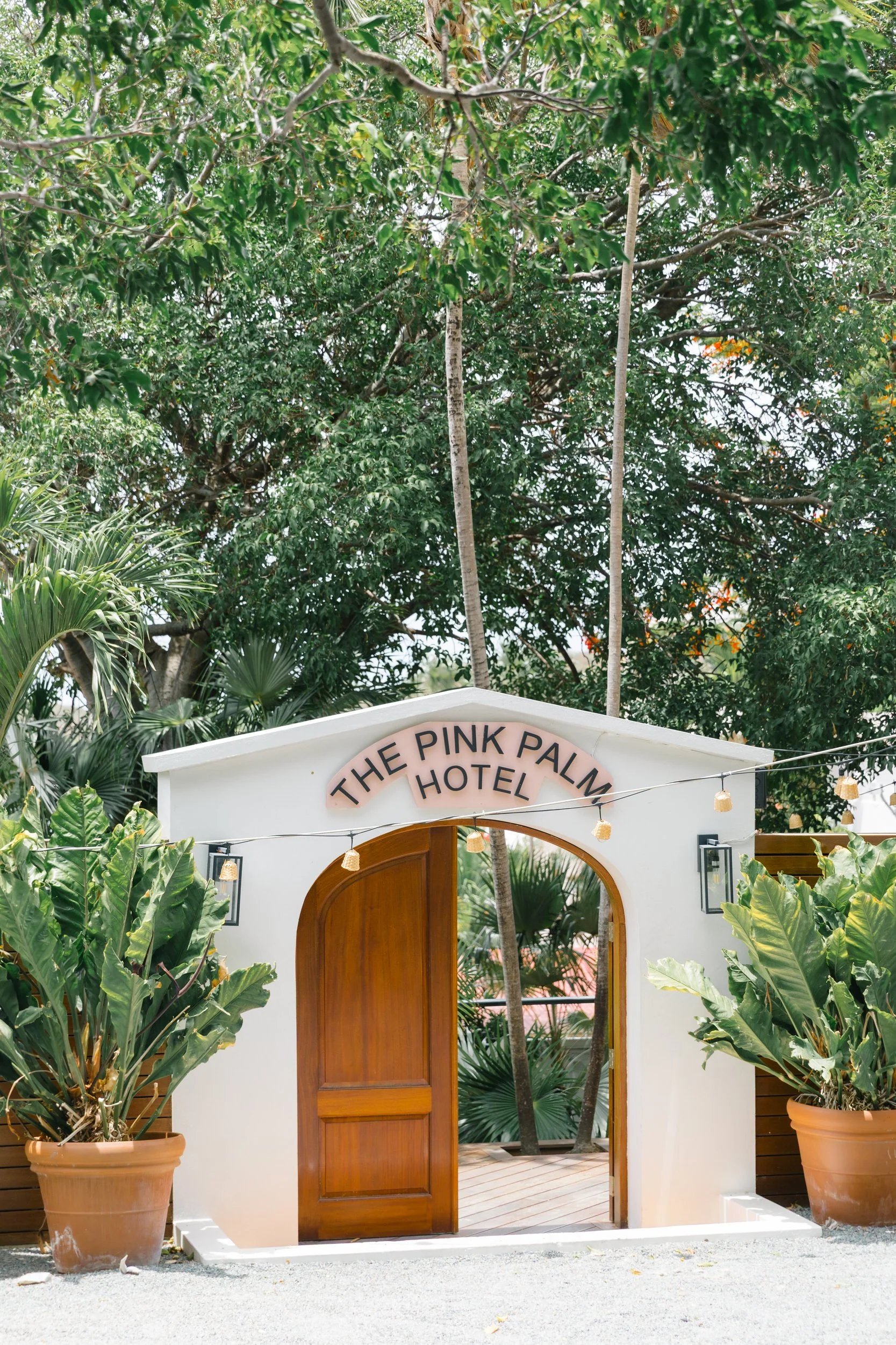 Exterior of The Pink Palm Hotel in Charlotte Amalie, St. Thomas with colorful pink architectural details