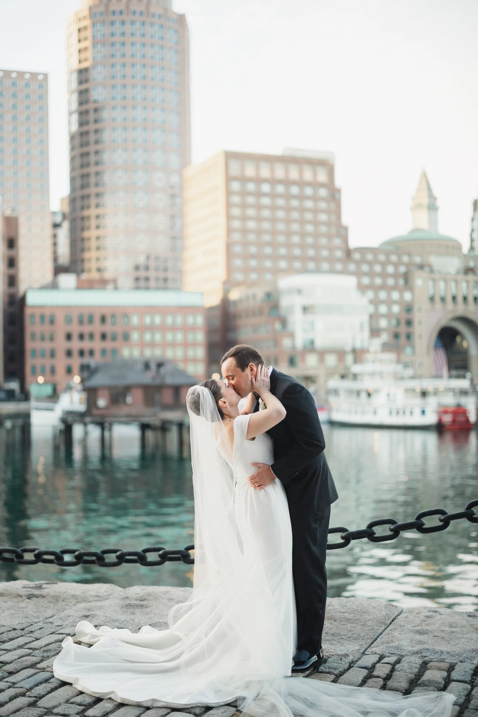 Waterfront sunset wedding portraits at Fan Pier Park in Boston