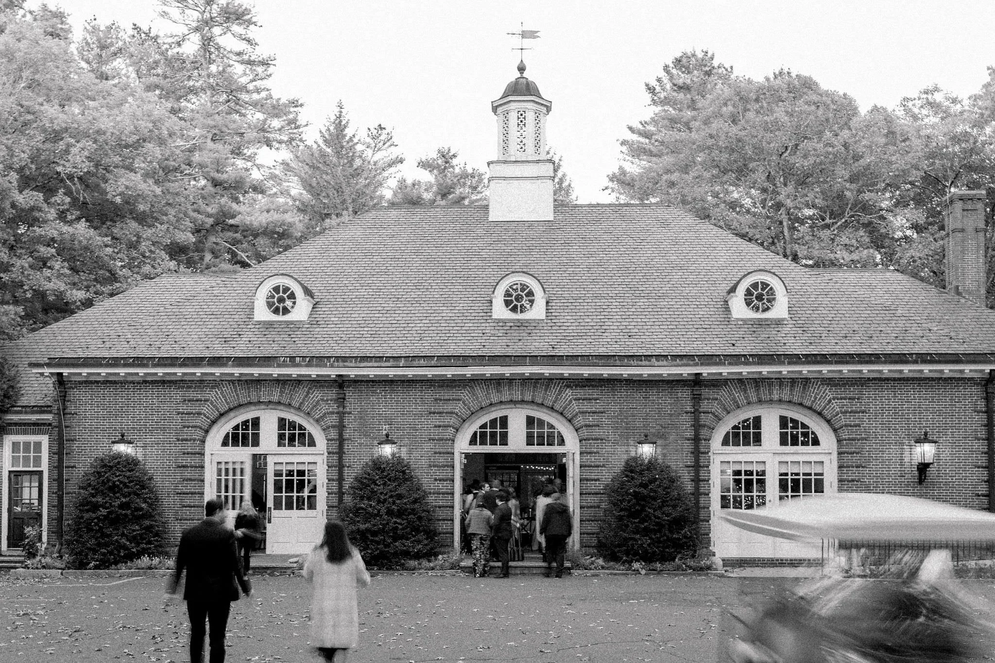 Guests enter wedding reception at Elm Bank in Wellesley, Massachusetts.