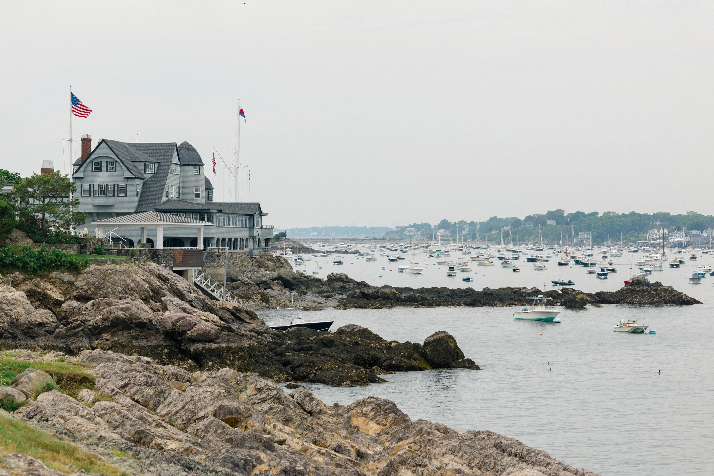A sweeping view of Marblehead Harbor from the Corinthian Yacht Club, where sailboats filled the water during this elegant New England wedding.