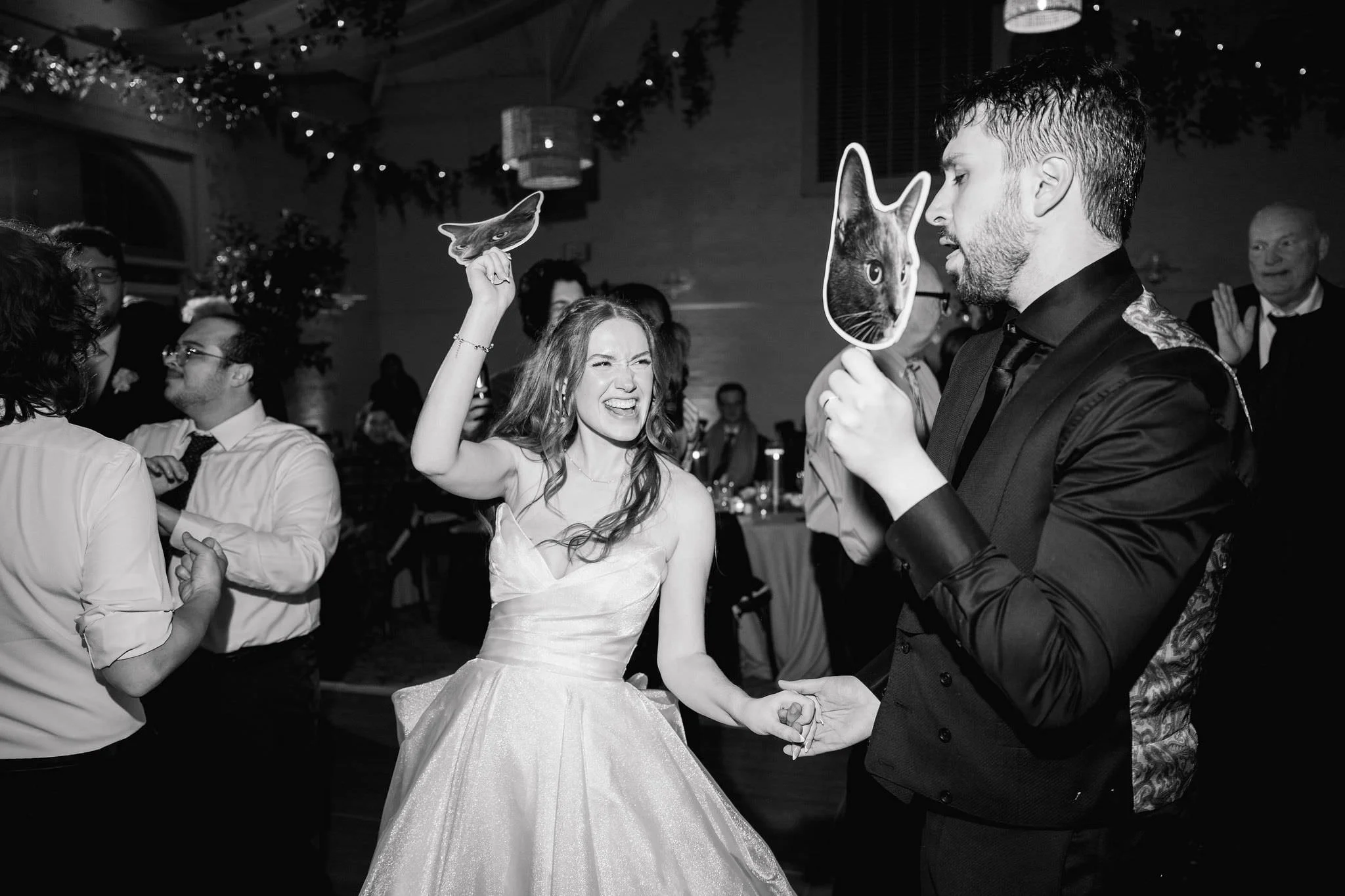 Candid photographs of guests dancing during a wedding reception at Elm Bank.