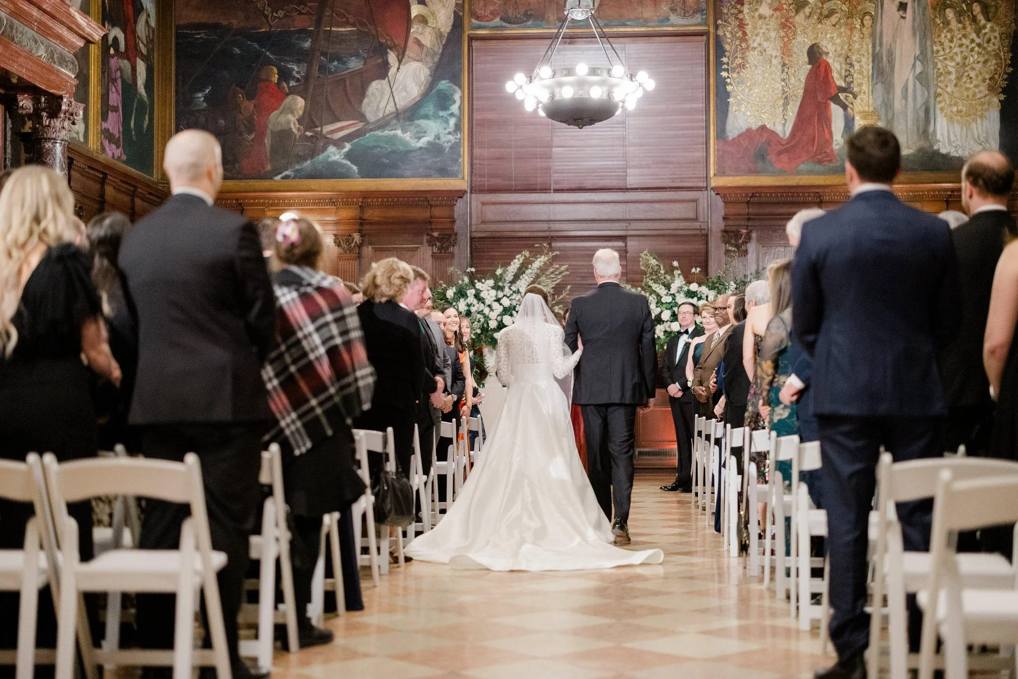 Bride walks down aisle during ceremony at Boston Public Library Wedding