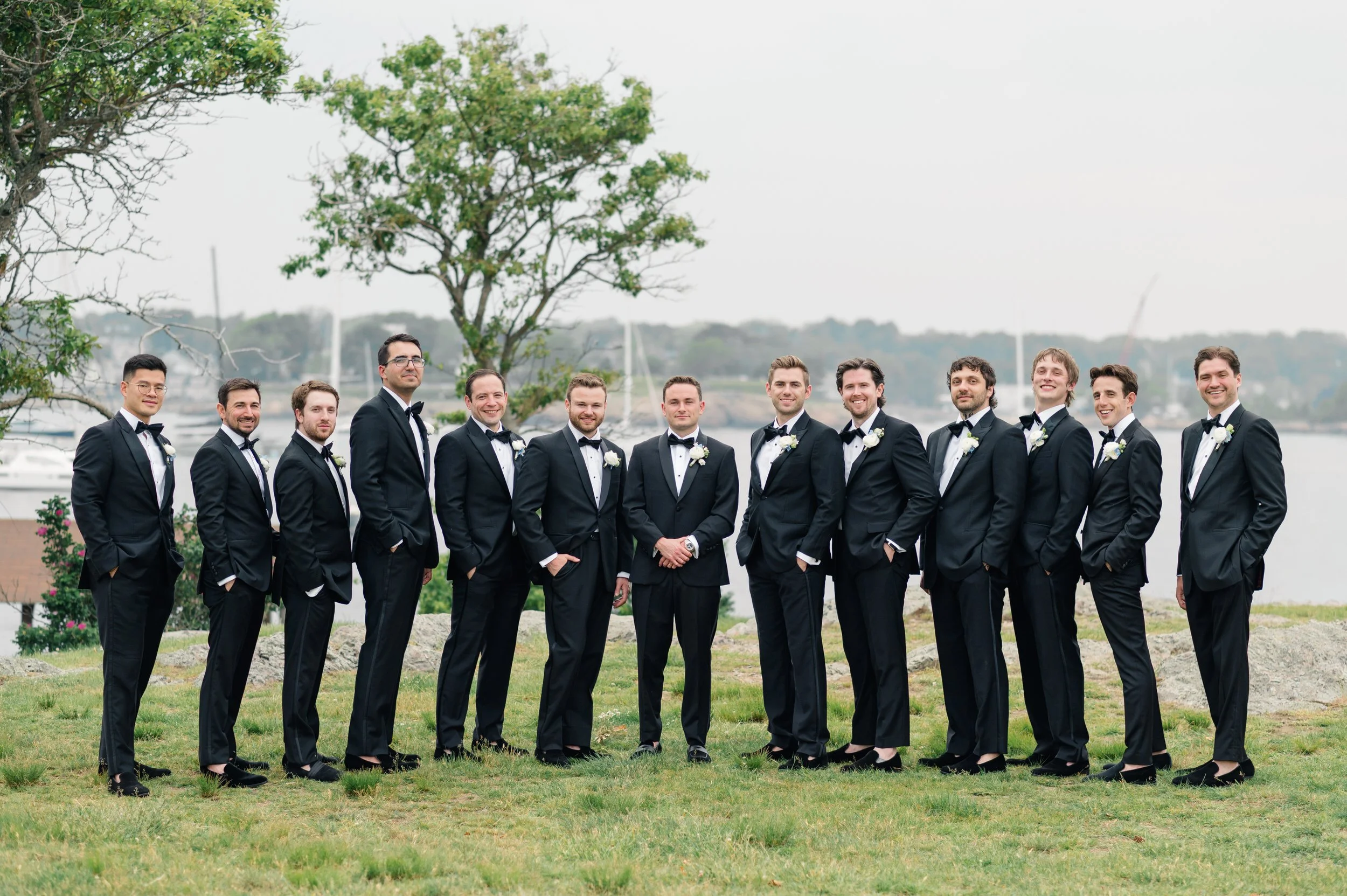Wedding party portraits overlooking Marblehead Harbor at Chandler Hovey Park.