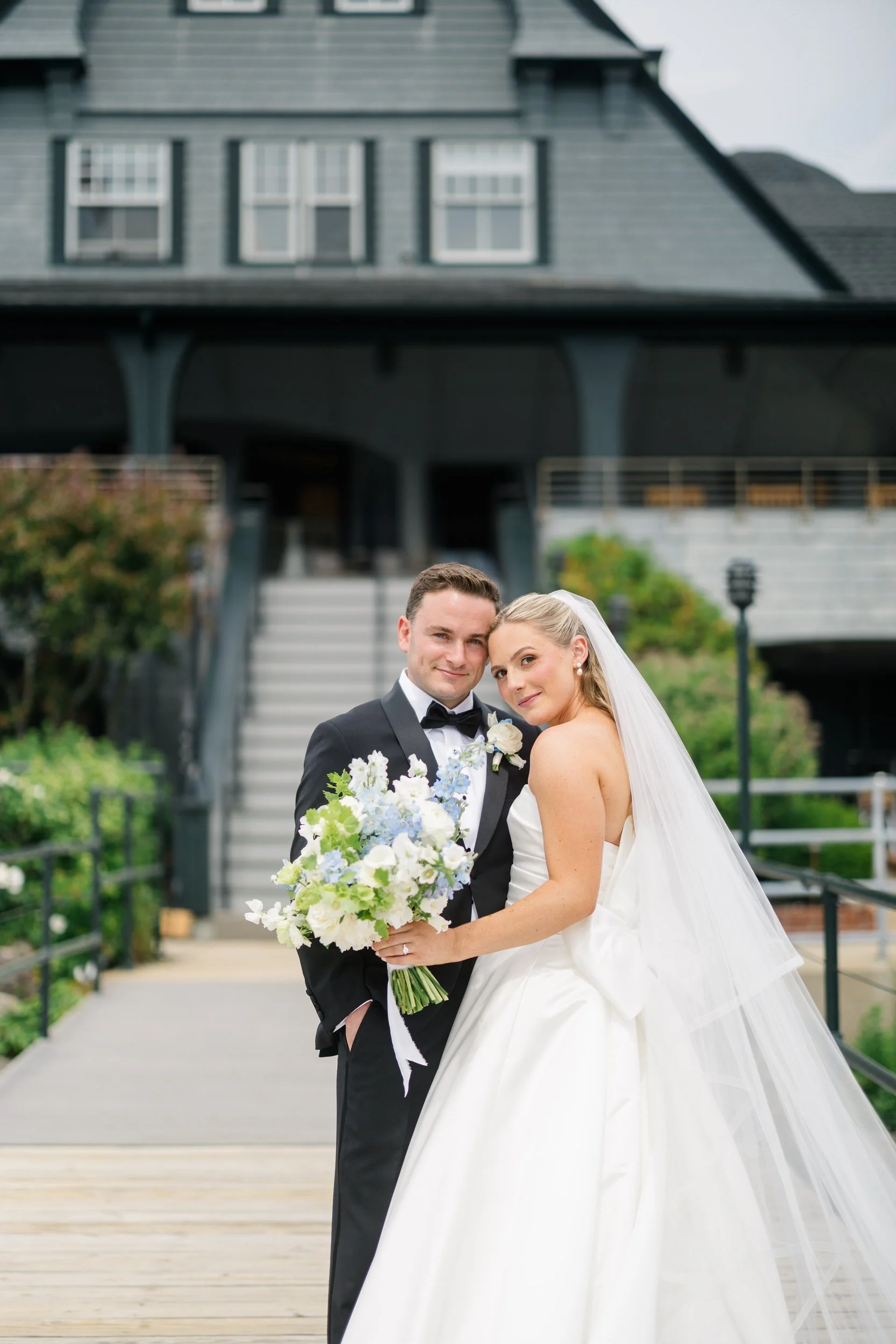 Romantic couple portraits on the dock at Corinthian Yacht Club in Marblehead, Massachusetts.