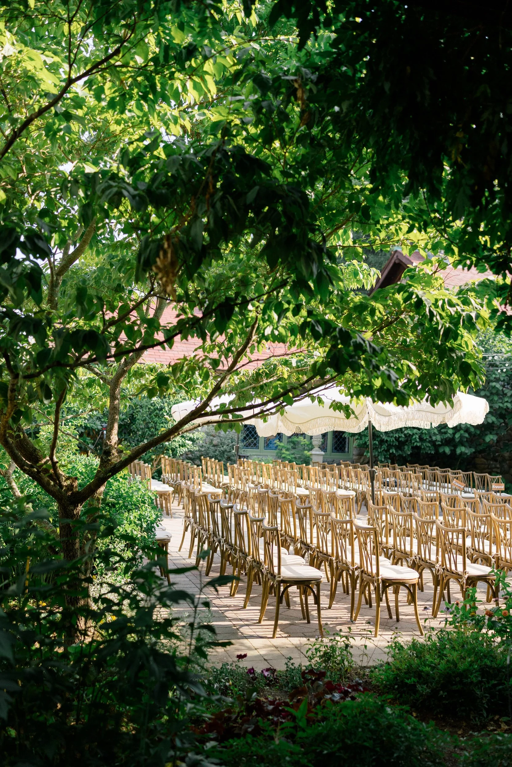 Garden ceremony aisle decorated with tropical inspired floral design in Topsfield MA