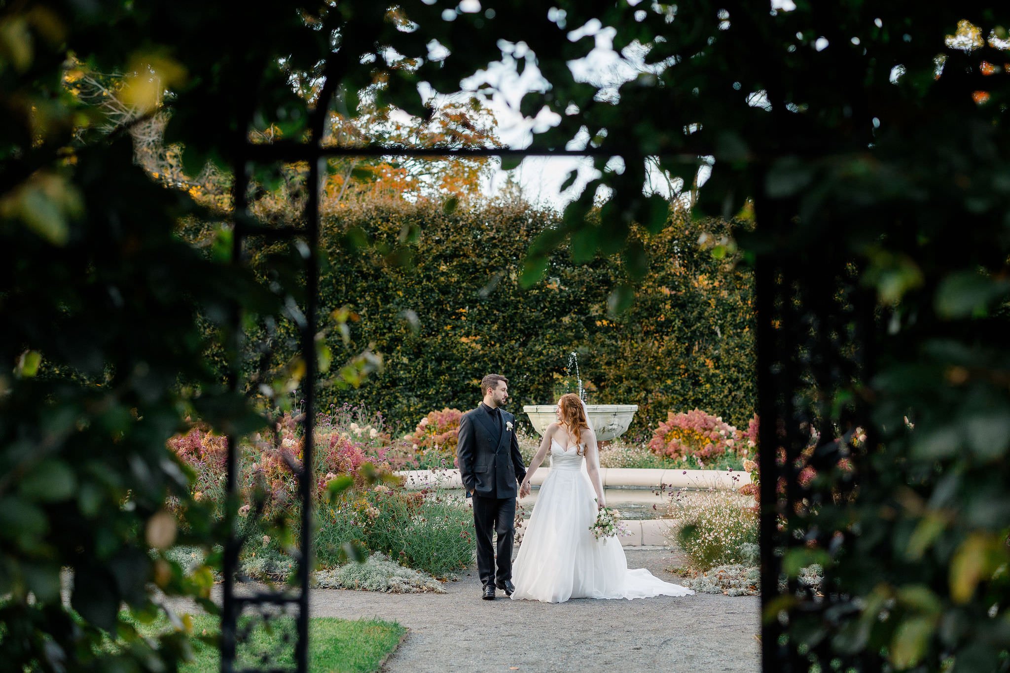 Wedding couple portraits surrounded by the autumn colors at Elm Bank Gardens.