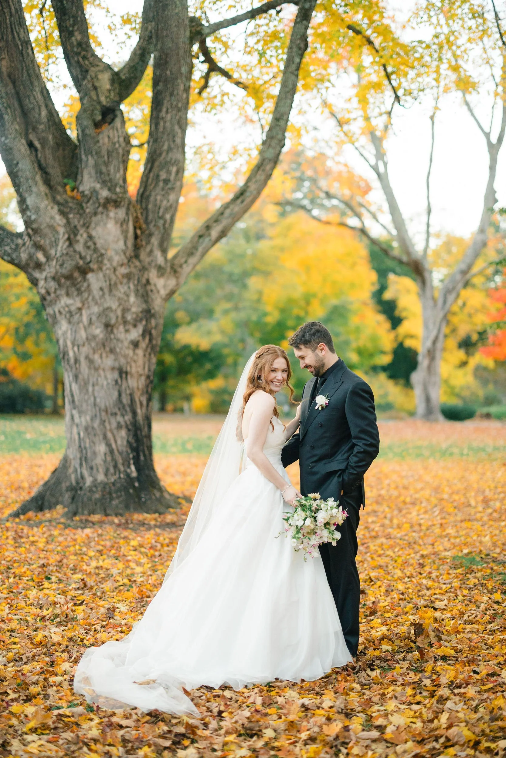 Wedding couple photographed at sunset during a fall wedding at Elm Bank.