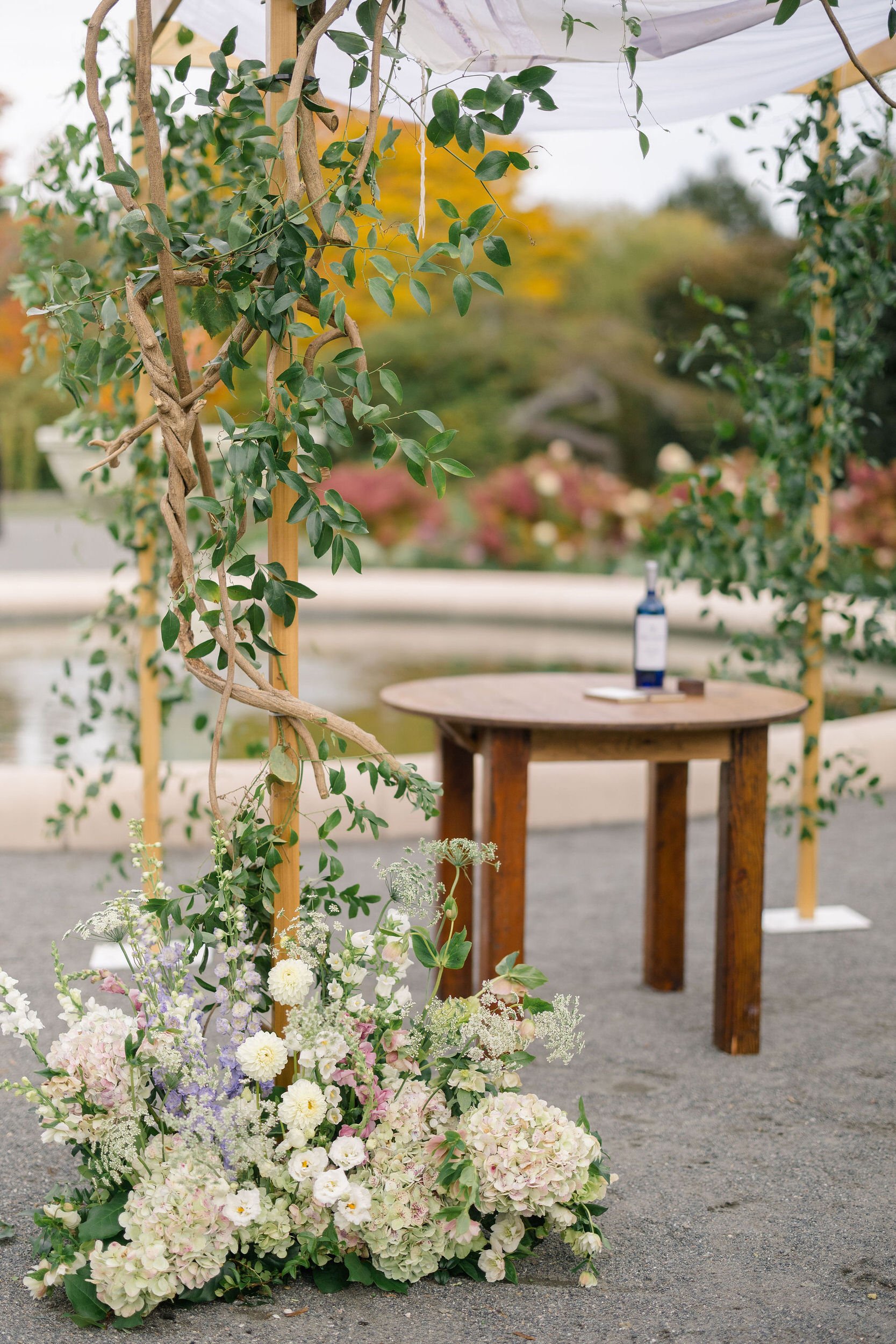 Wedding ceremony setting and floral details at Elm Bank Gardens.