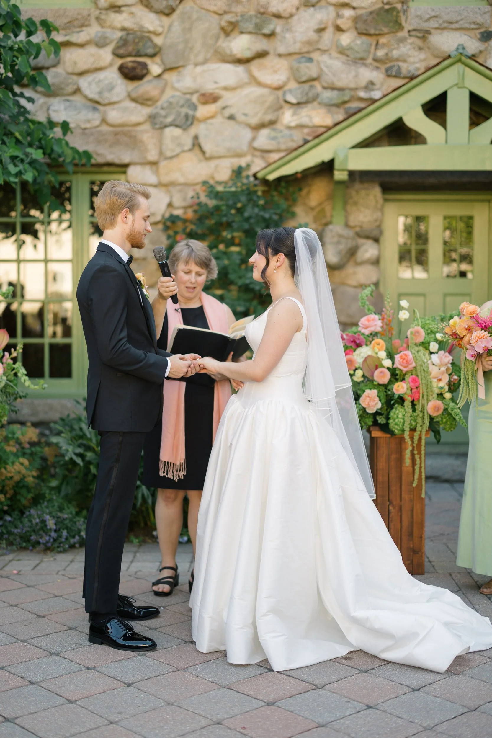 Bride and groom exchanging vows at outdoor ceremony at Willowdale Estate Massachusetts