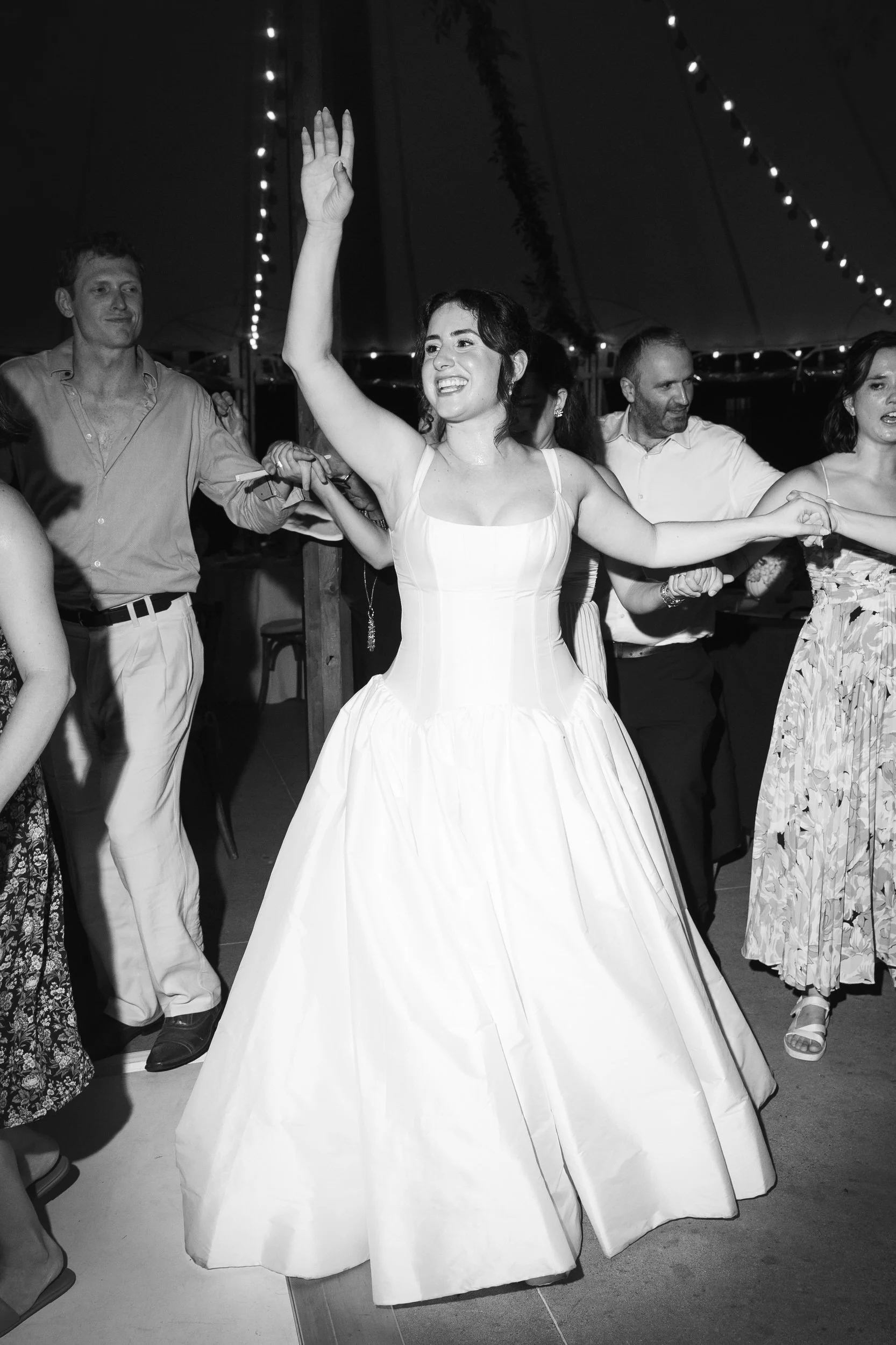 Wedding guests dancing at colorful Willowdale Estate reception in Massachusetts