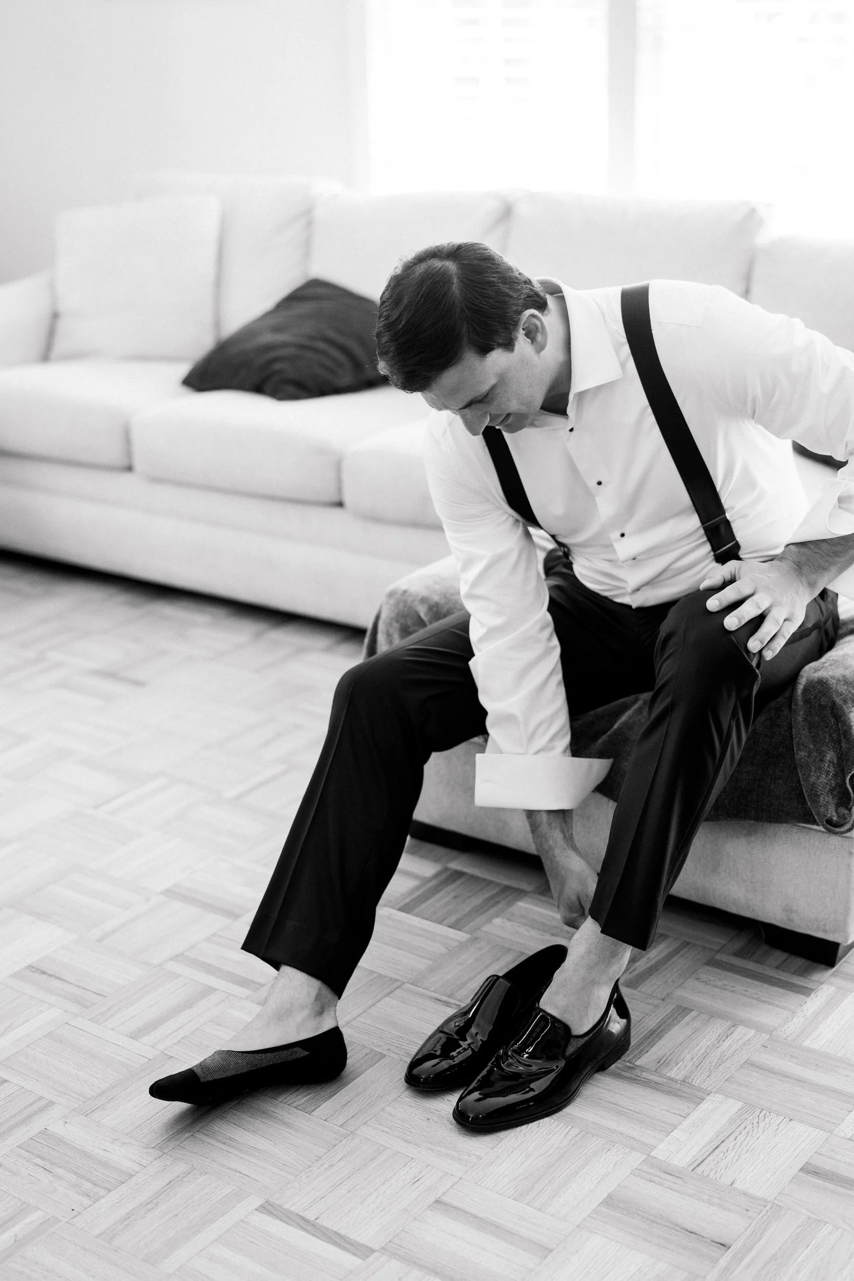 Groom getting ready with groomsmen before the wedding ceremony
