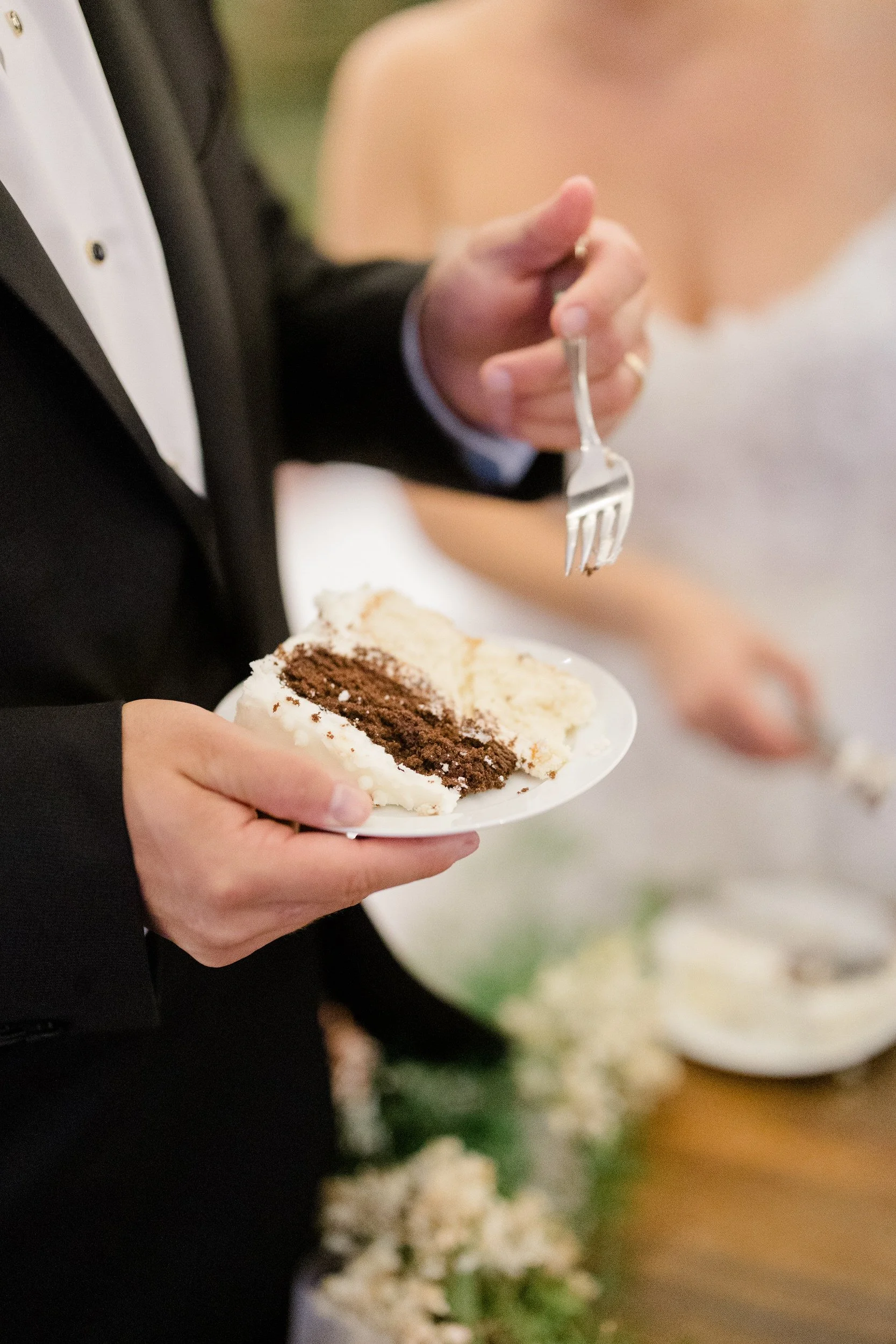 Bride and groom cutting their wedding cake from Jojo's Bakery Shop at their Cape Cod private estate wedding.