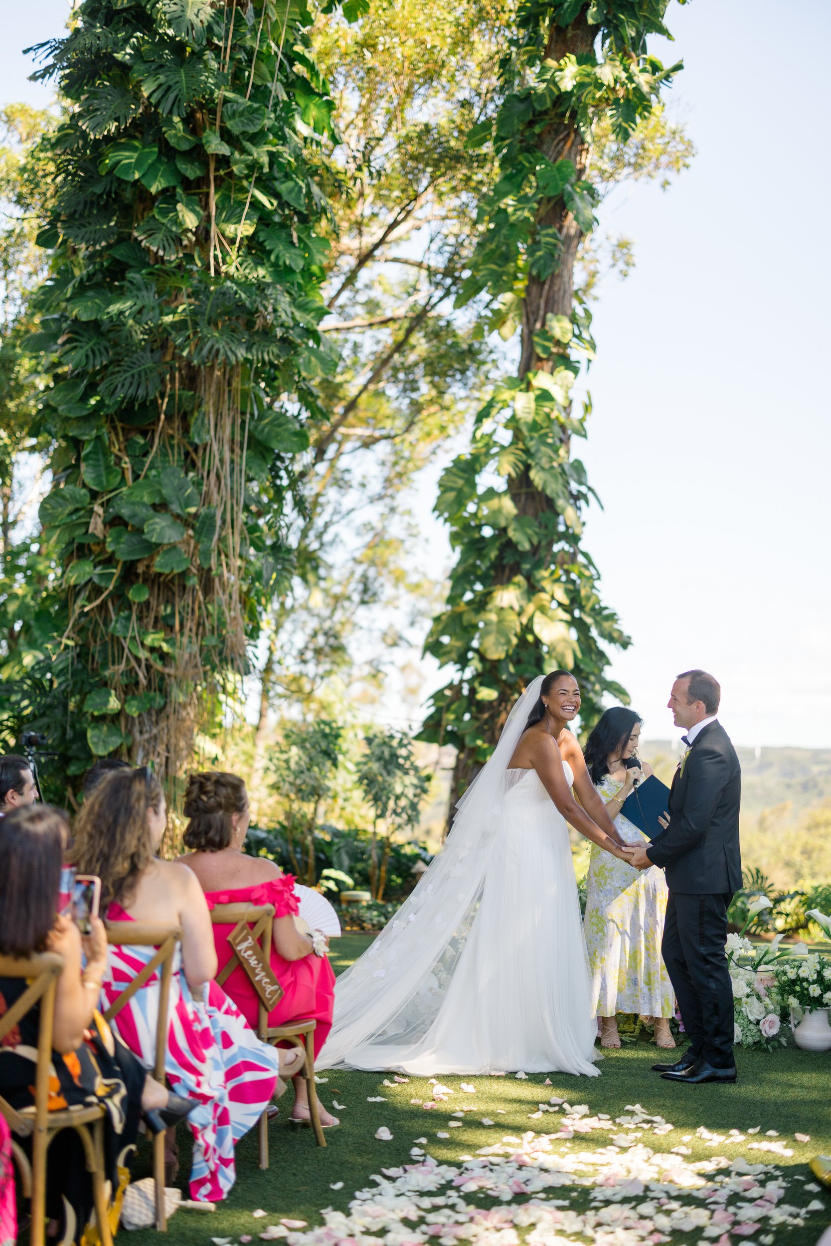 couple exchanging vows at sunset ranch hawaii wedding on oahu