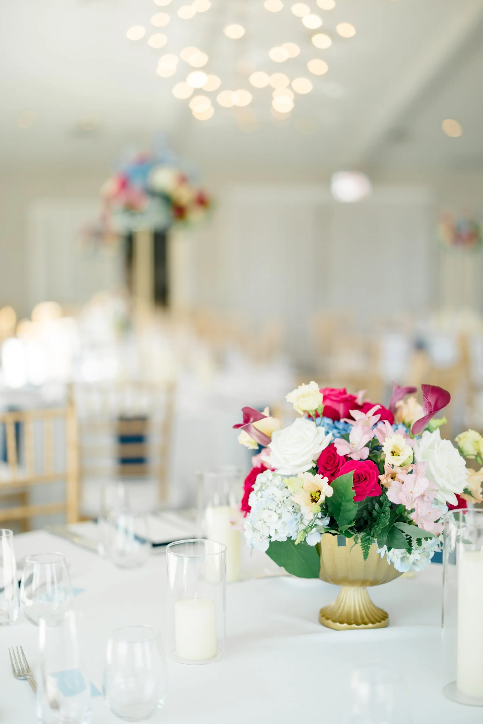 Guests celebrating at a fall wedding reception in the Wychmere Beach Club Ocean Room.