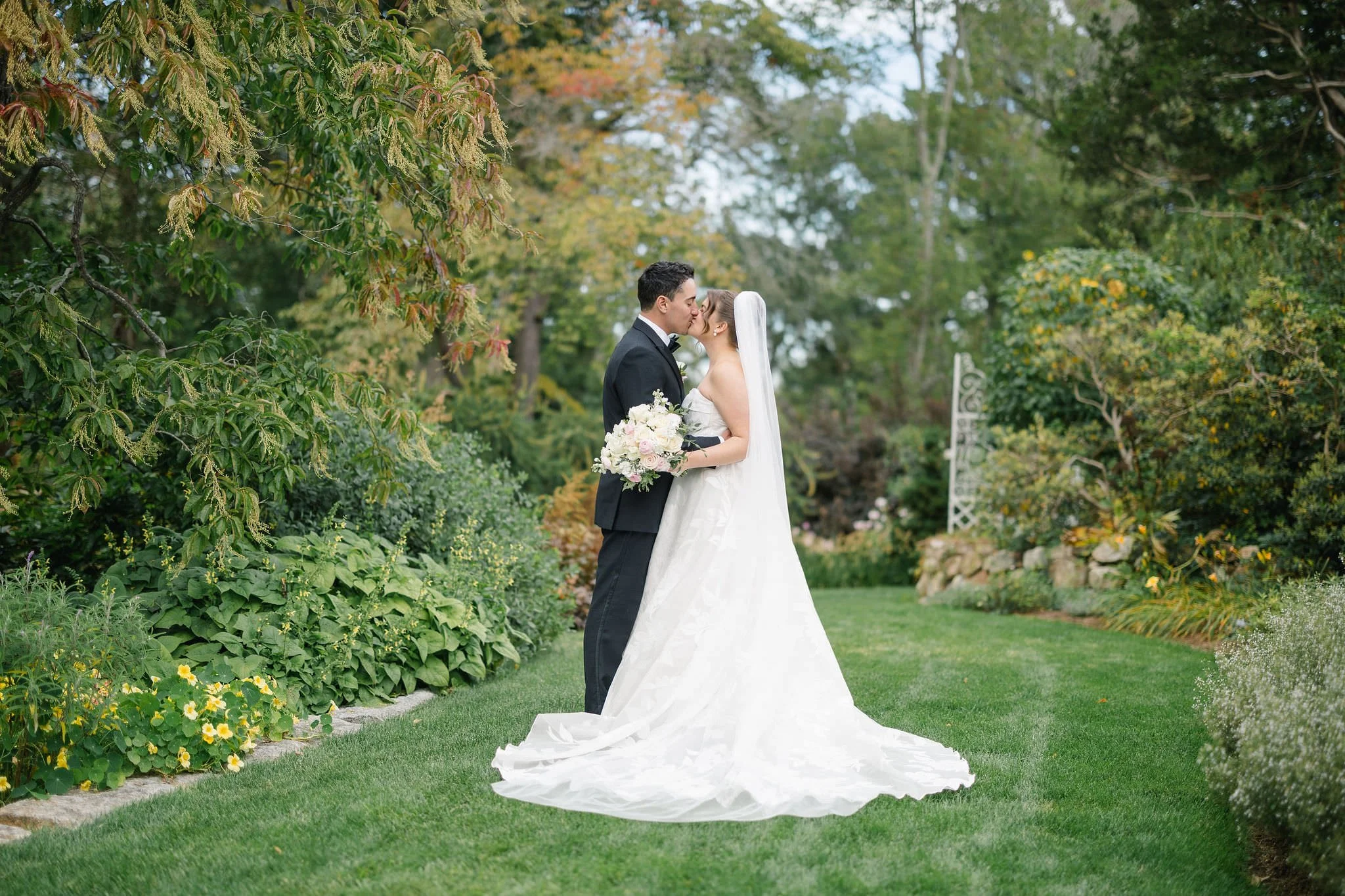Wedding couple photographed among the gardens at Long Hill in Beverly, Massachusetts.