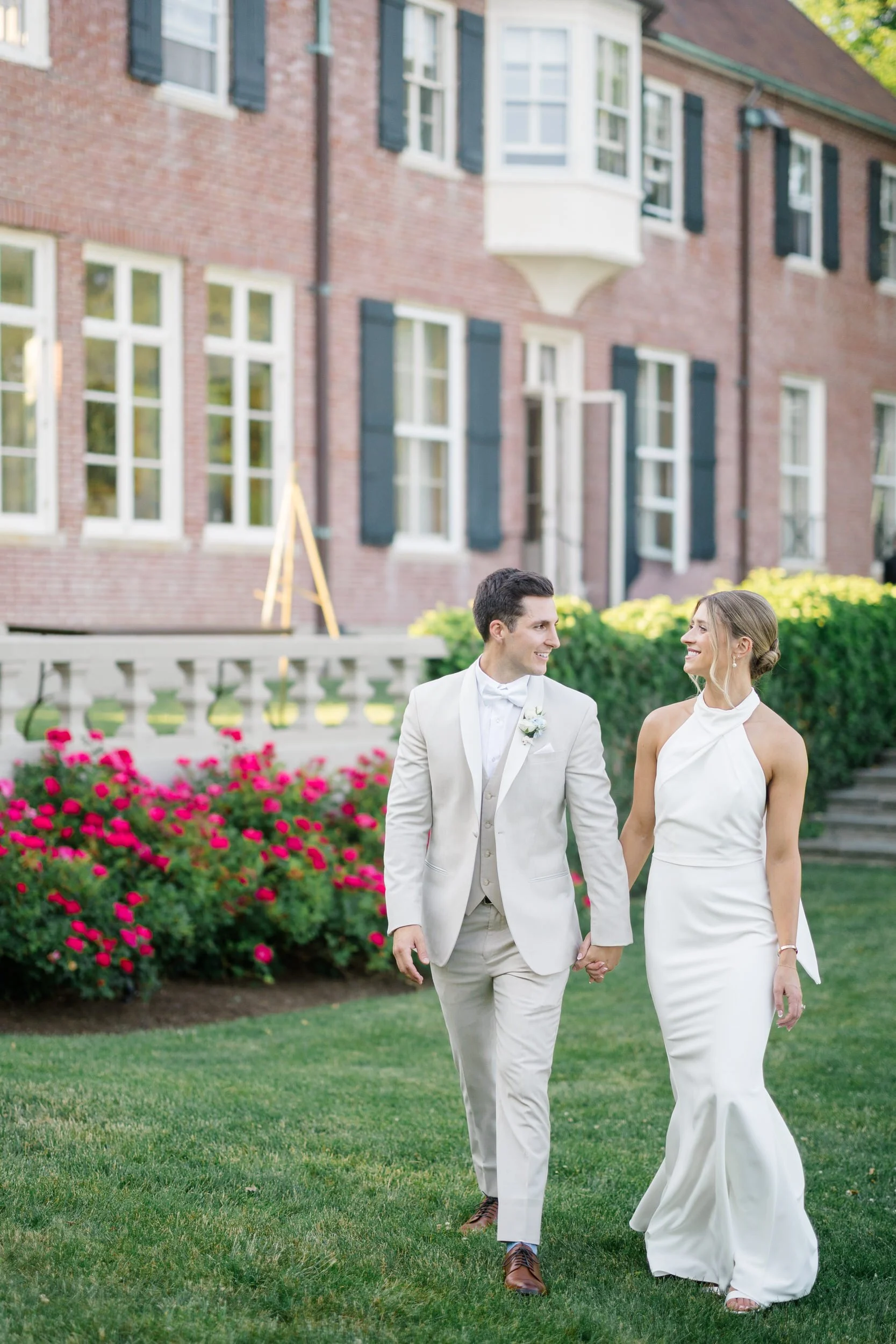 Newlywed couple photographed during sunset on a summer wedding day.
