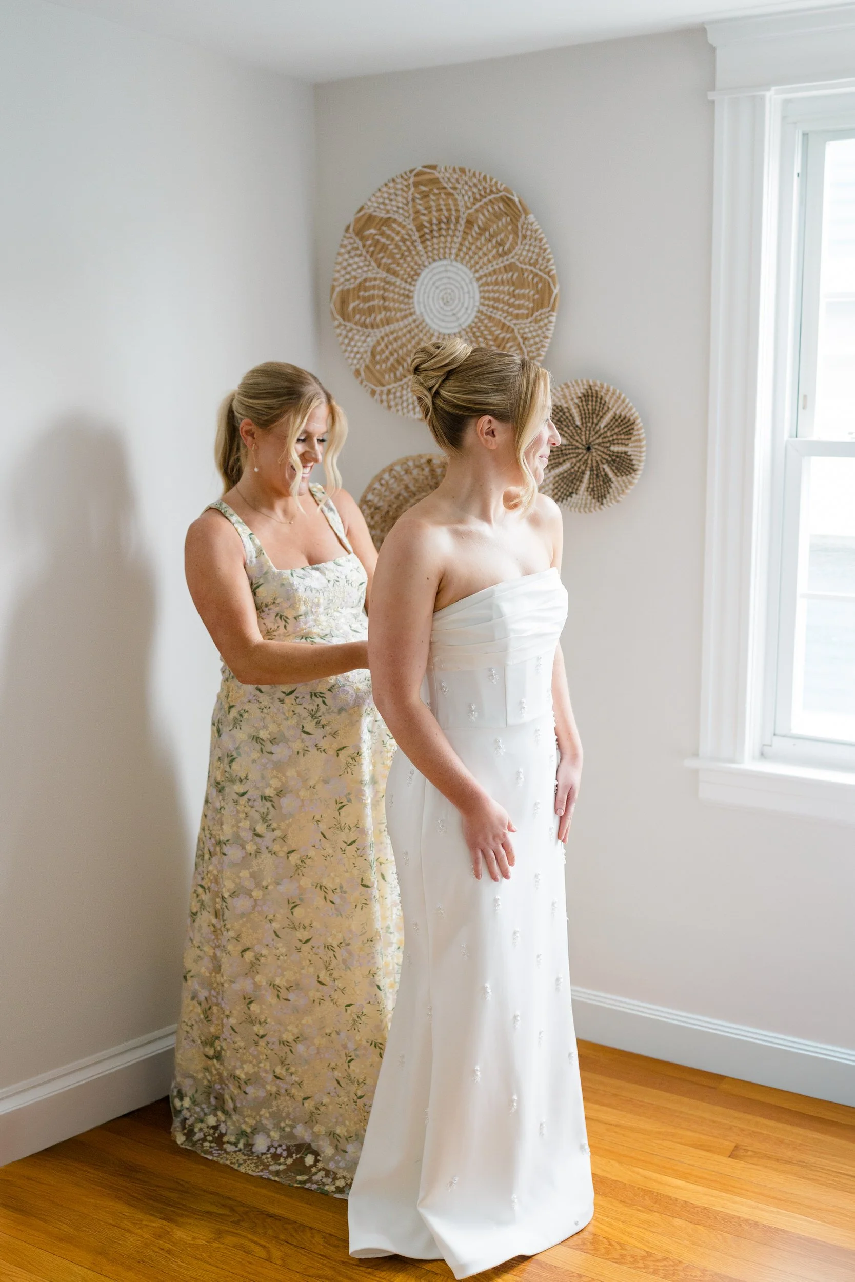 Bride getting ready in her beaded Watters wedding gown before her Blithewold Wedding in Bristol, Rhode Island.