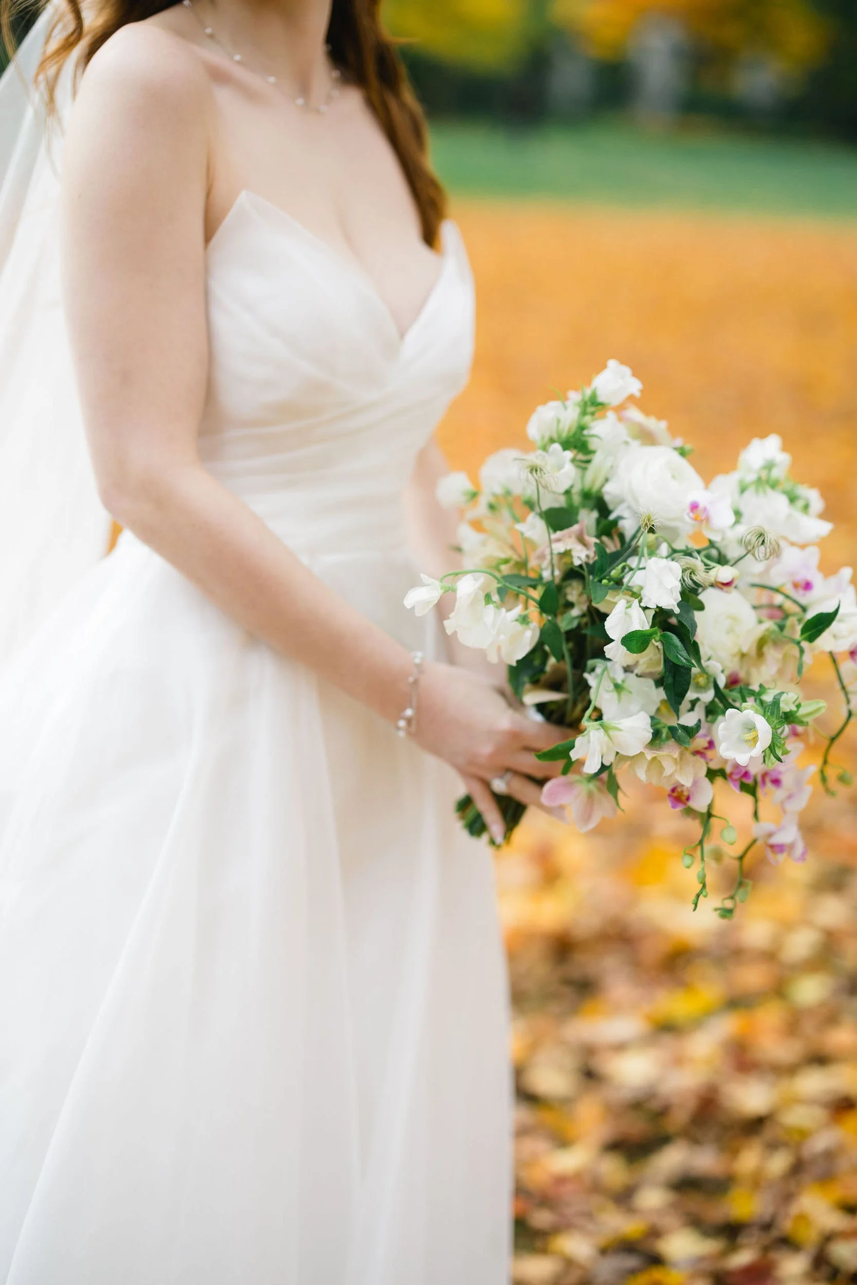 Bride posing among the garden scenery at Elm Bank Gardens in Wellesley, Massachusetts.