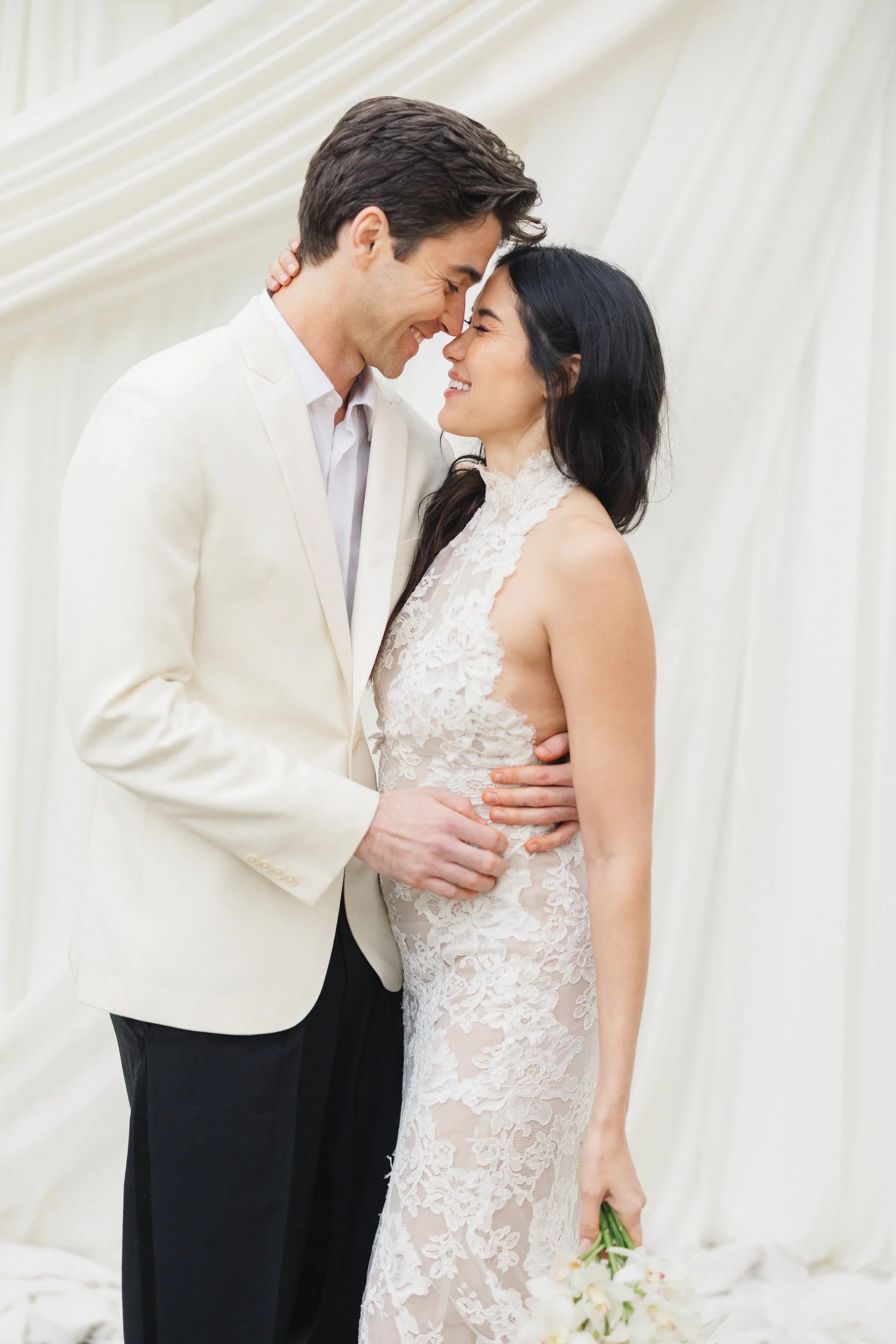 Charleston wedding couple portraits at outdoor ceremony altar with drapery