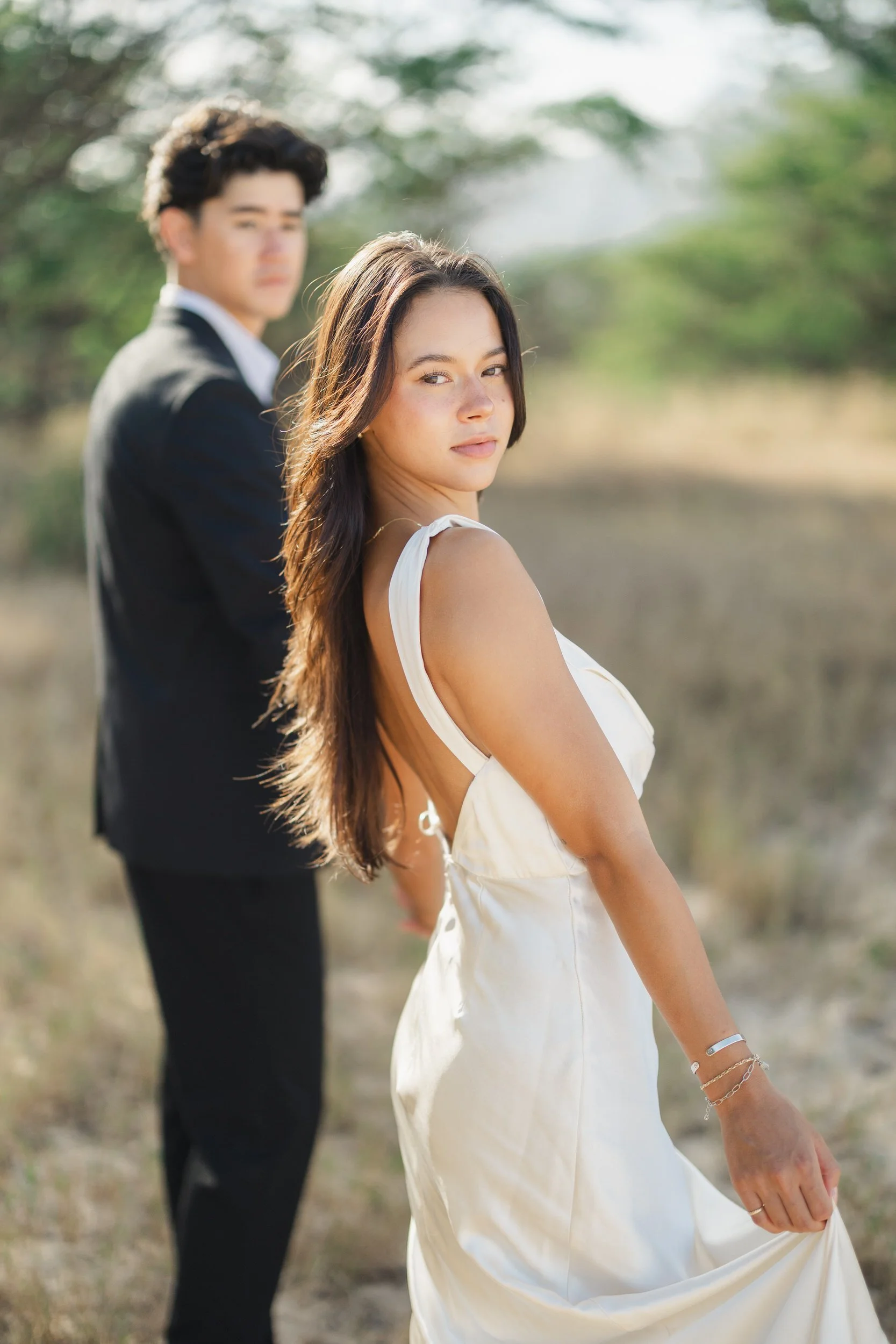 Bride and groom walking together during Oahu sunrise elopement