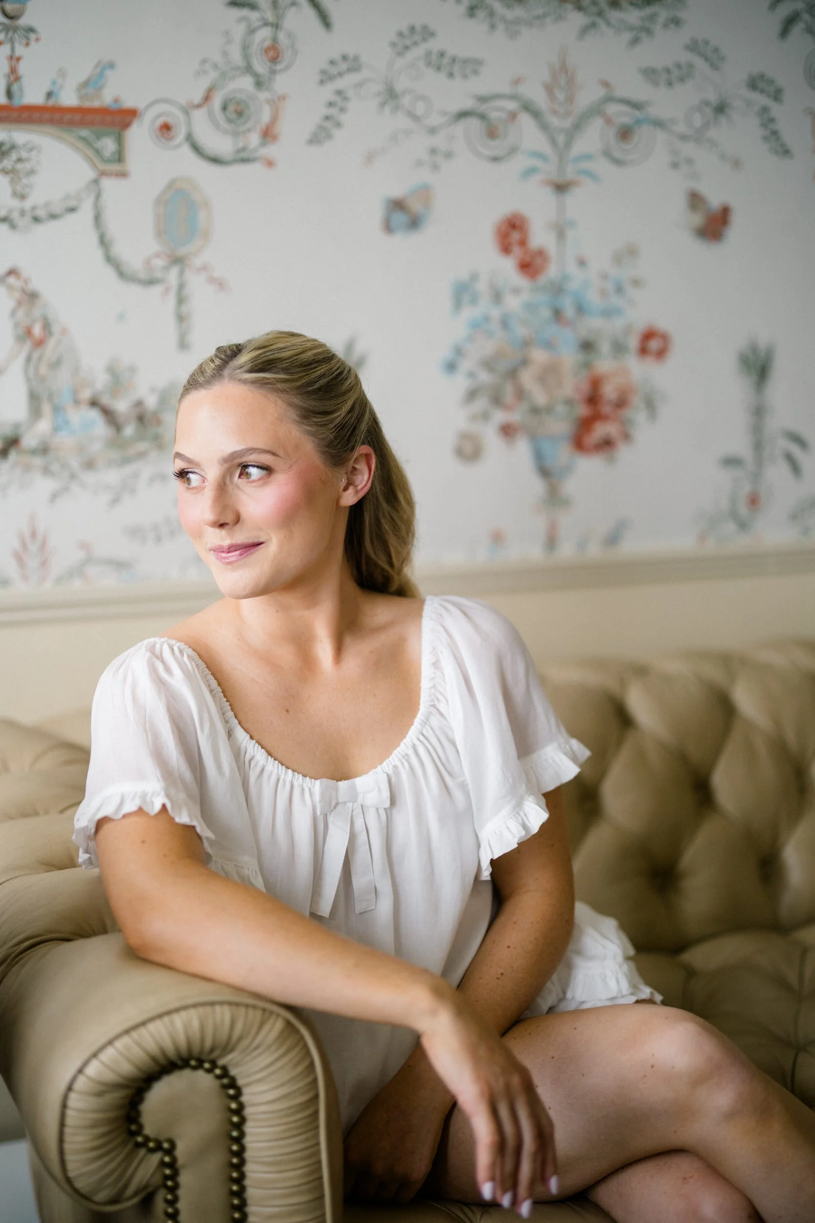 The bride getting ready at Corinthian Yacht Club in Marblehead, Massachusetts for her timeless coastal wedding.