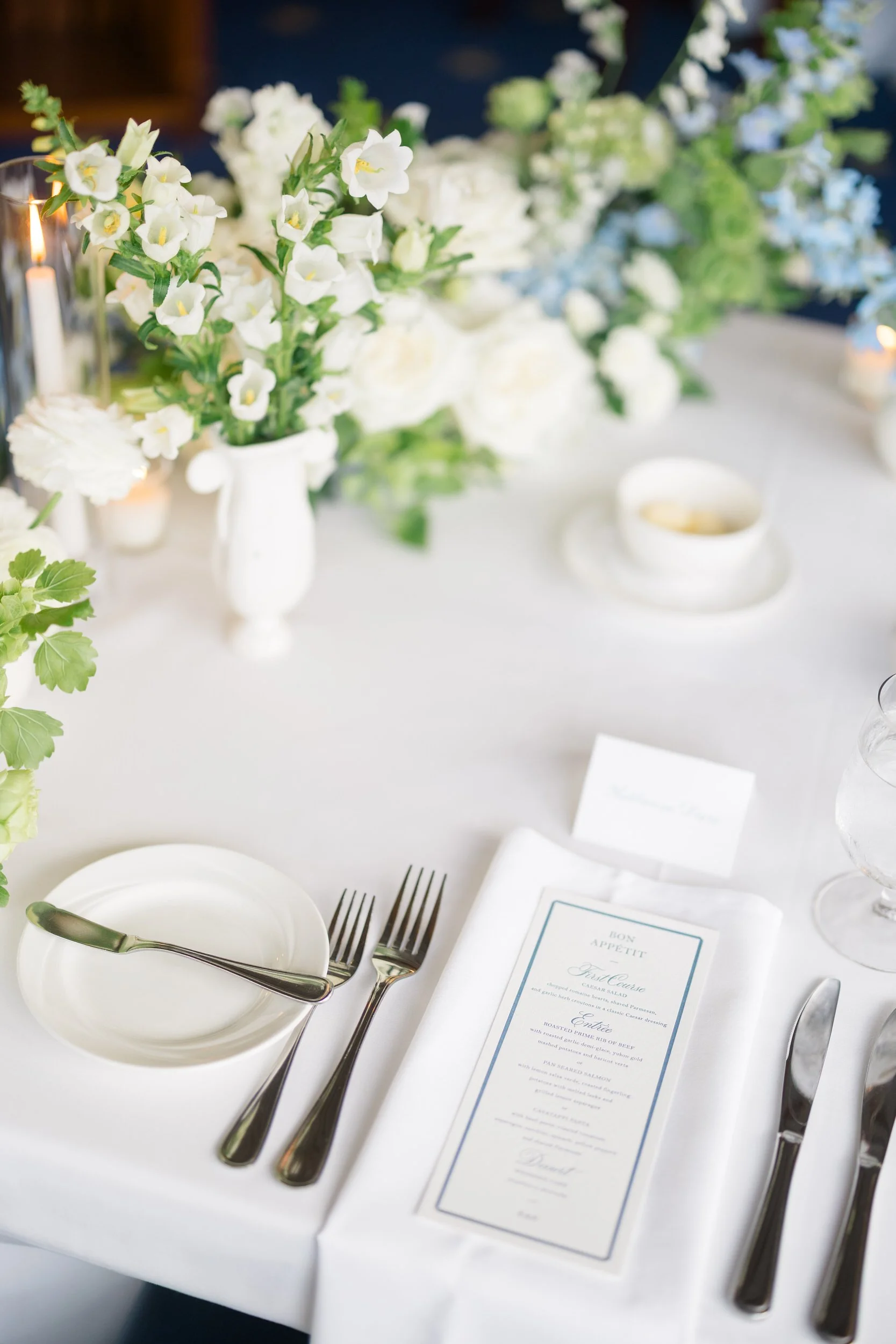Elegant reception details from a Corinthian Yacht Club wedding with handmade ceramic vases created by the bride’s mother.